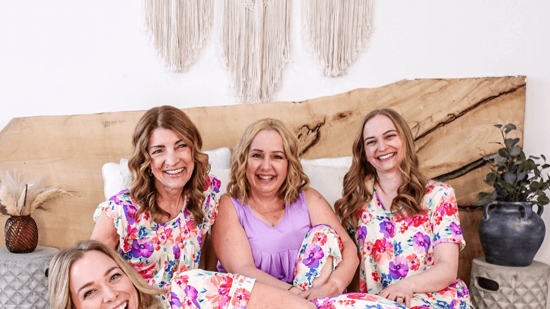 Georgia Rylan Spring 2025 collection featuring four women in colorful floral pajamas, showcasing comfort and style.