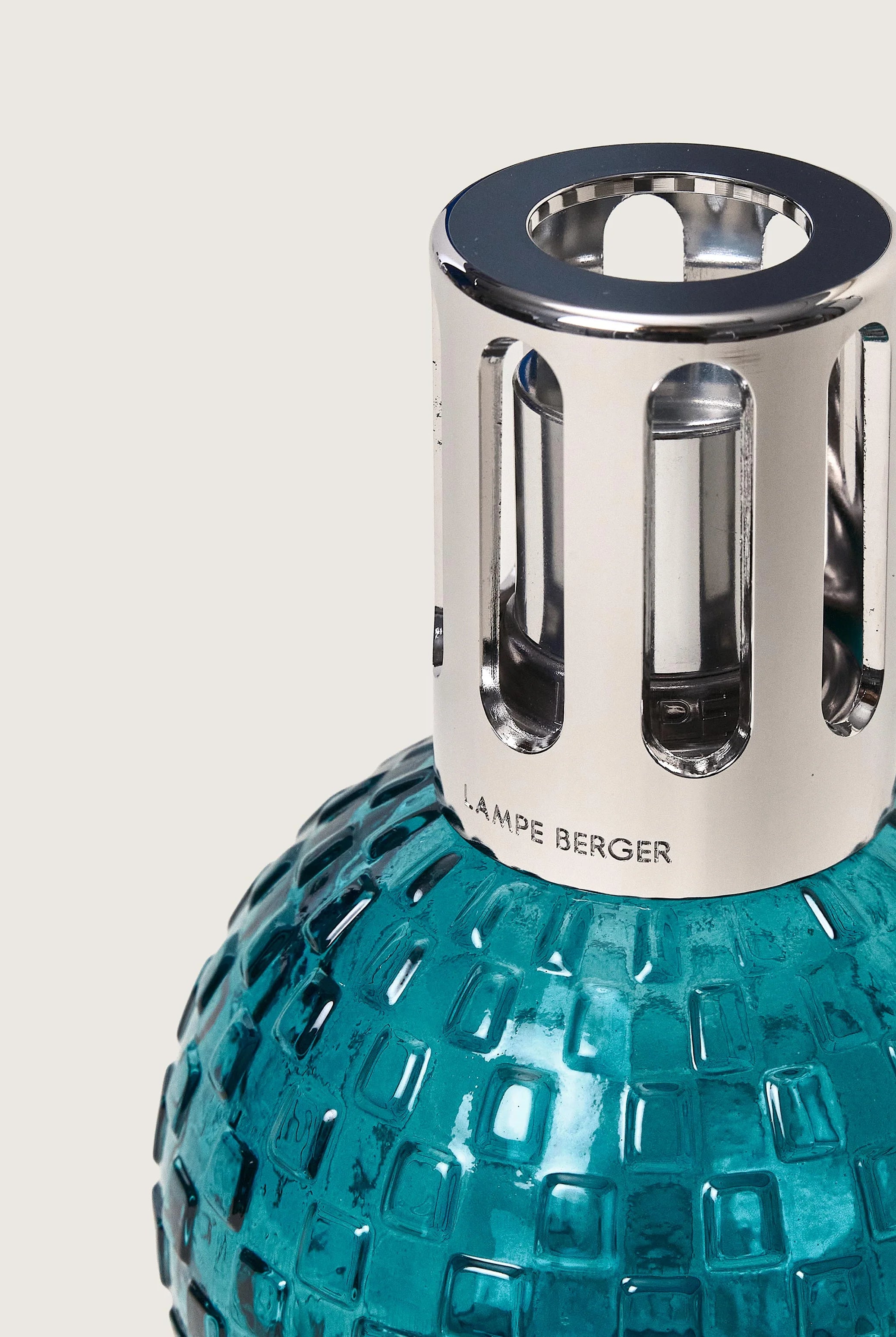 Maison Berger Paris Disco Fragrance Lamp Gift Set featuring a teal lamp and fragrance bottle. showing close up of bottle