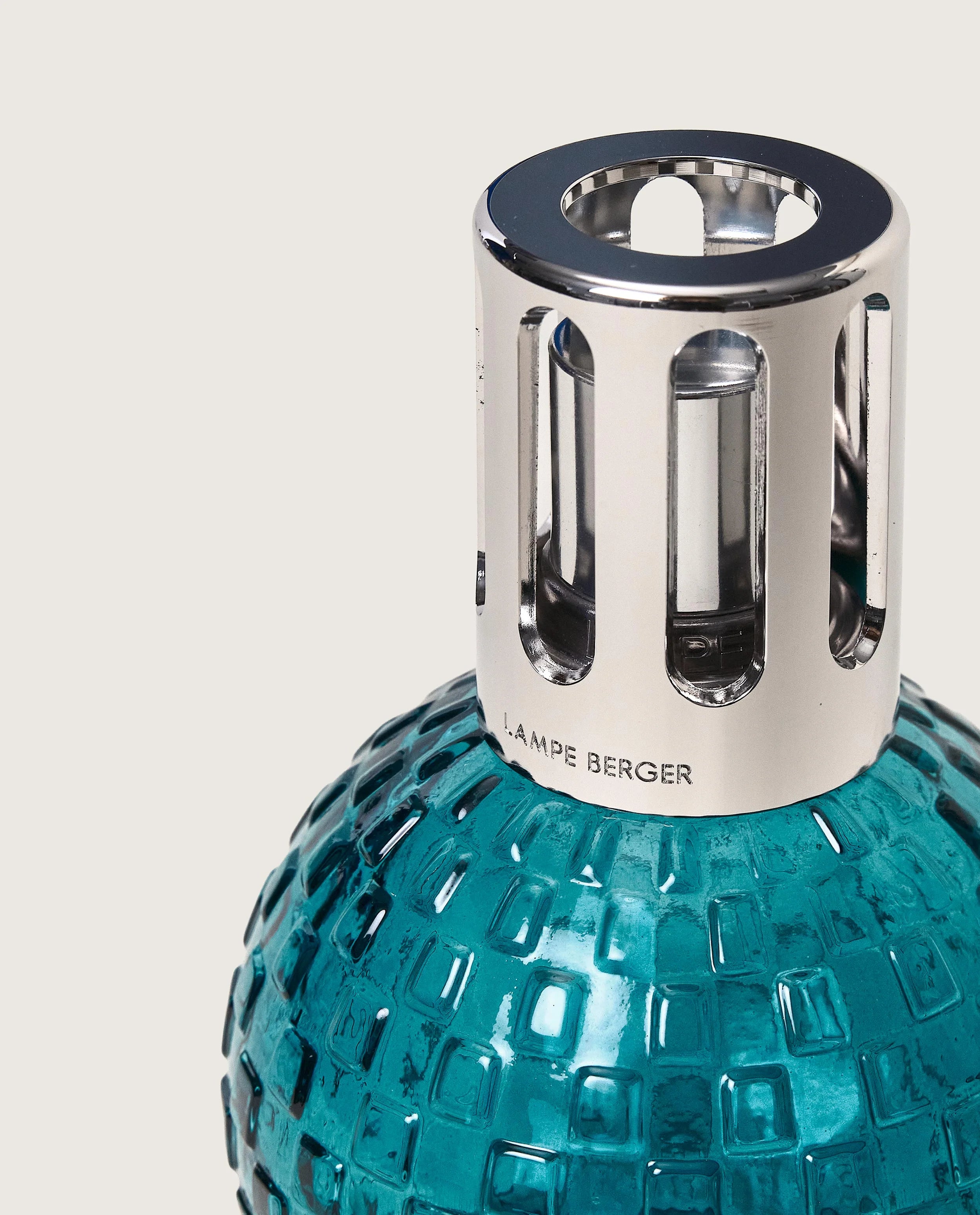 Maison Berger Paris Disco Fragrance Lamp Gift Set featuring a teal lamp and fragrance bottle. showing close up of bottle
