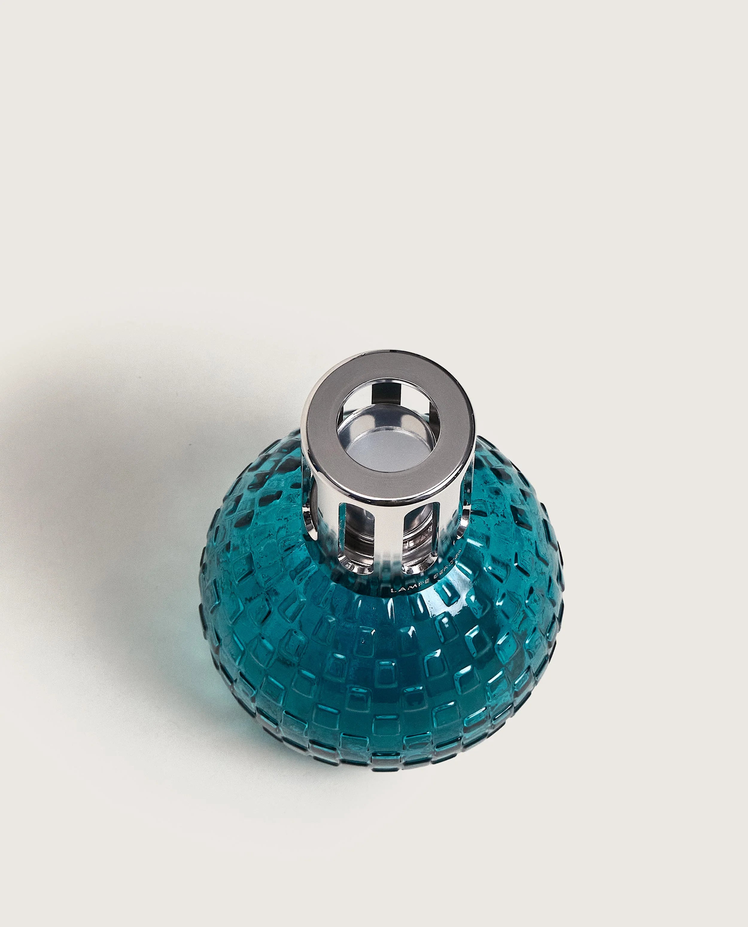 Maison Berger Paris Disco Fragrance Lamp Gift Set featuring a teal lamp and fragrance bottle. showing top of bottle