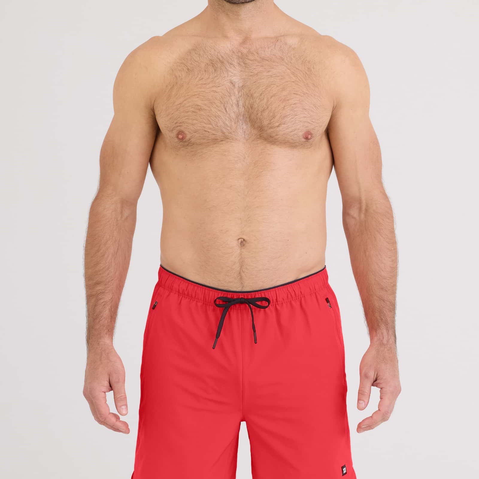 Model wearing red Power Moves 2N1 Short 7 for active training, showcasing the 4-way stretch design.