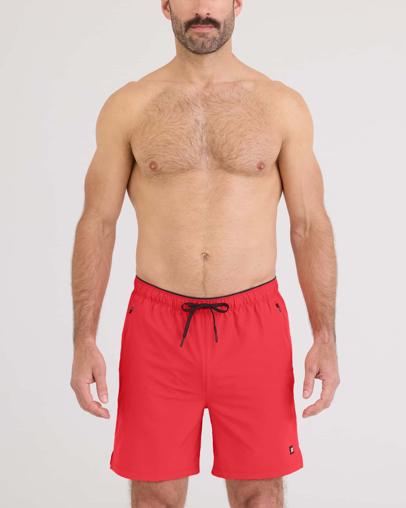 Model wearing red Power Moves 2N1 Short 7 for active training, showcasing the 4-way stretch design.