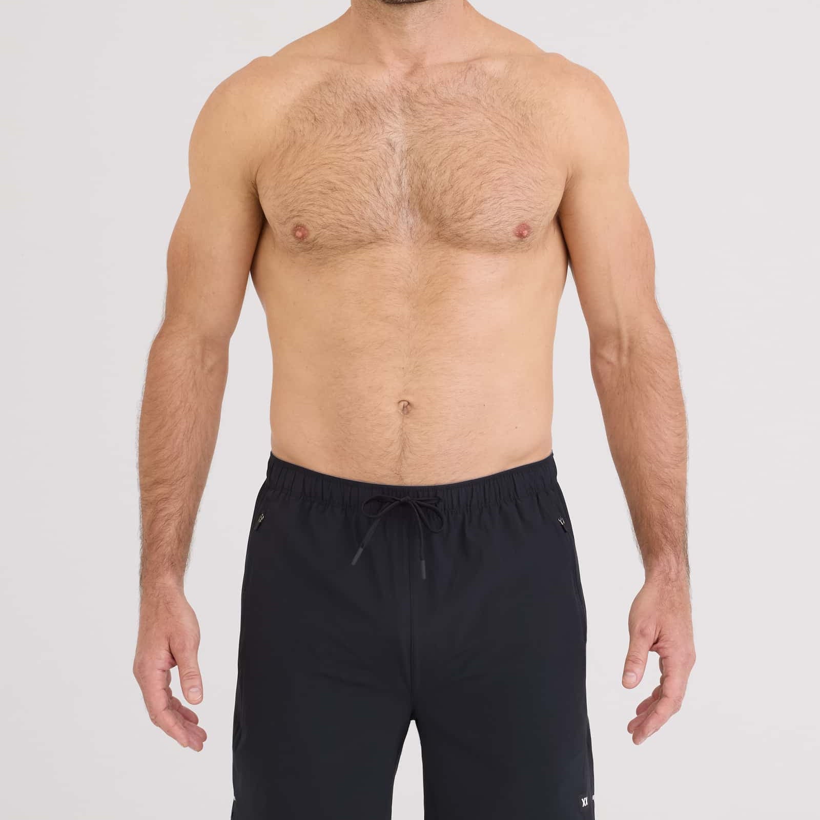 Man wearing Power Moves 2N1 Short 7 in black, showcasing comfort and performance for runners and gym enthusiasts.