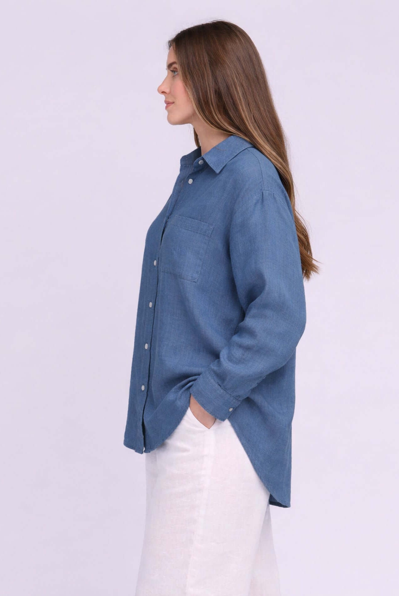 Yoga Jeans Elena Linen Oversized Button Up Top in soft blue, showcasing a side view with relaxed fit and stylish buttons.
