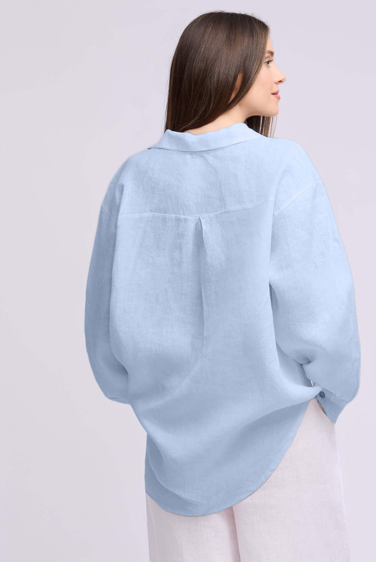 Yoga Jeans Elena Linen Oversized Button Up Top in light blue, showcasing a chic, relaxed fit from the back.