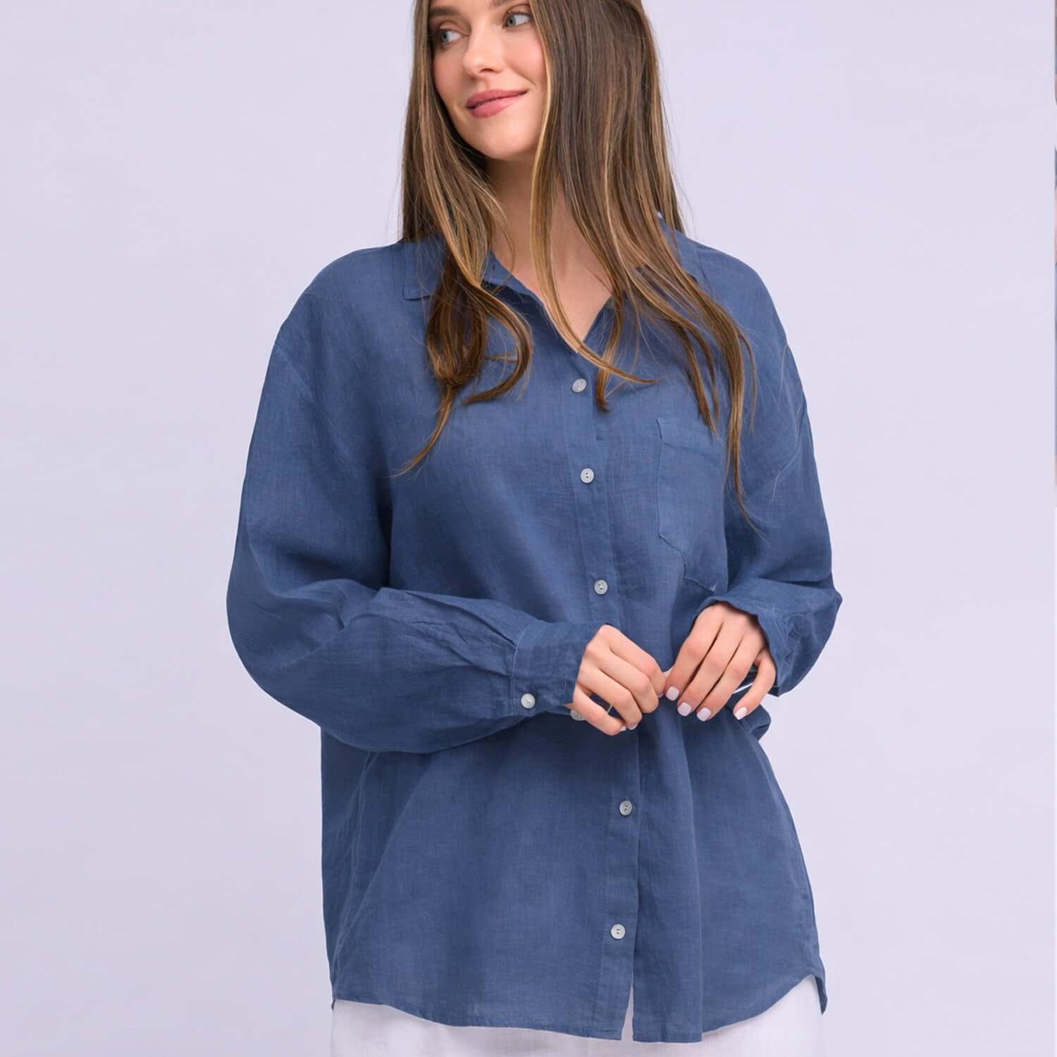 Yoga Jeans Elena Linen Oversized Button Up Top in a soft blue color, featuring a relaxed fit and button-down front.
