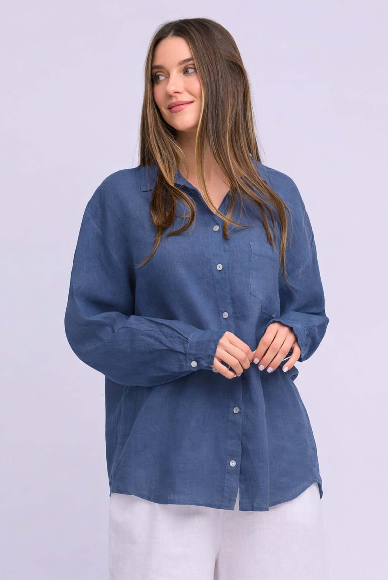 Yoga Jeans Elena Linen Oversized Button Up Top in a soft blue color, featuring a relaxed fit and button-down front.