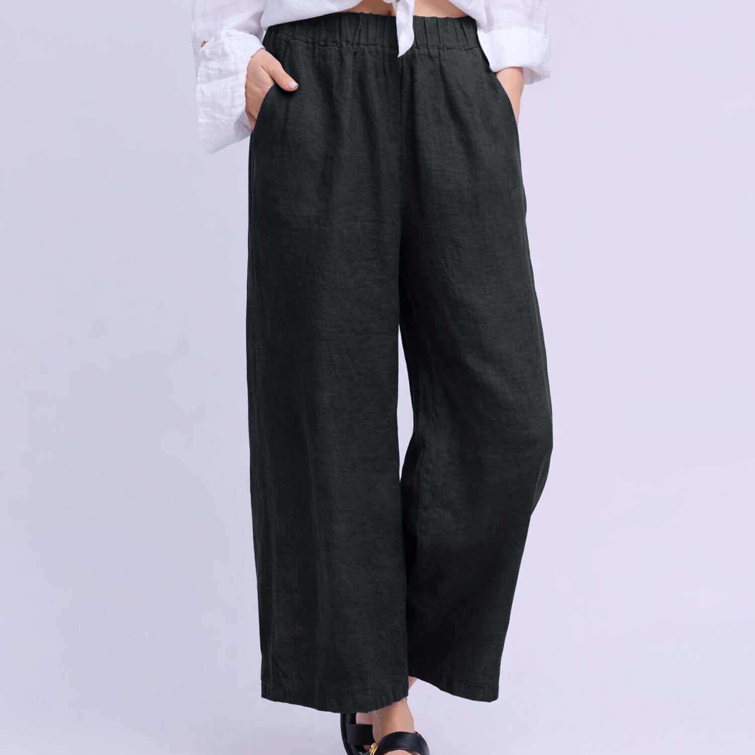 YOGA JEANS Sofia Linen Wide Leg Pant showcased on model wearing a white shirt and sandals.
