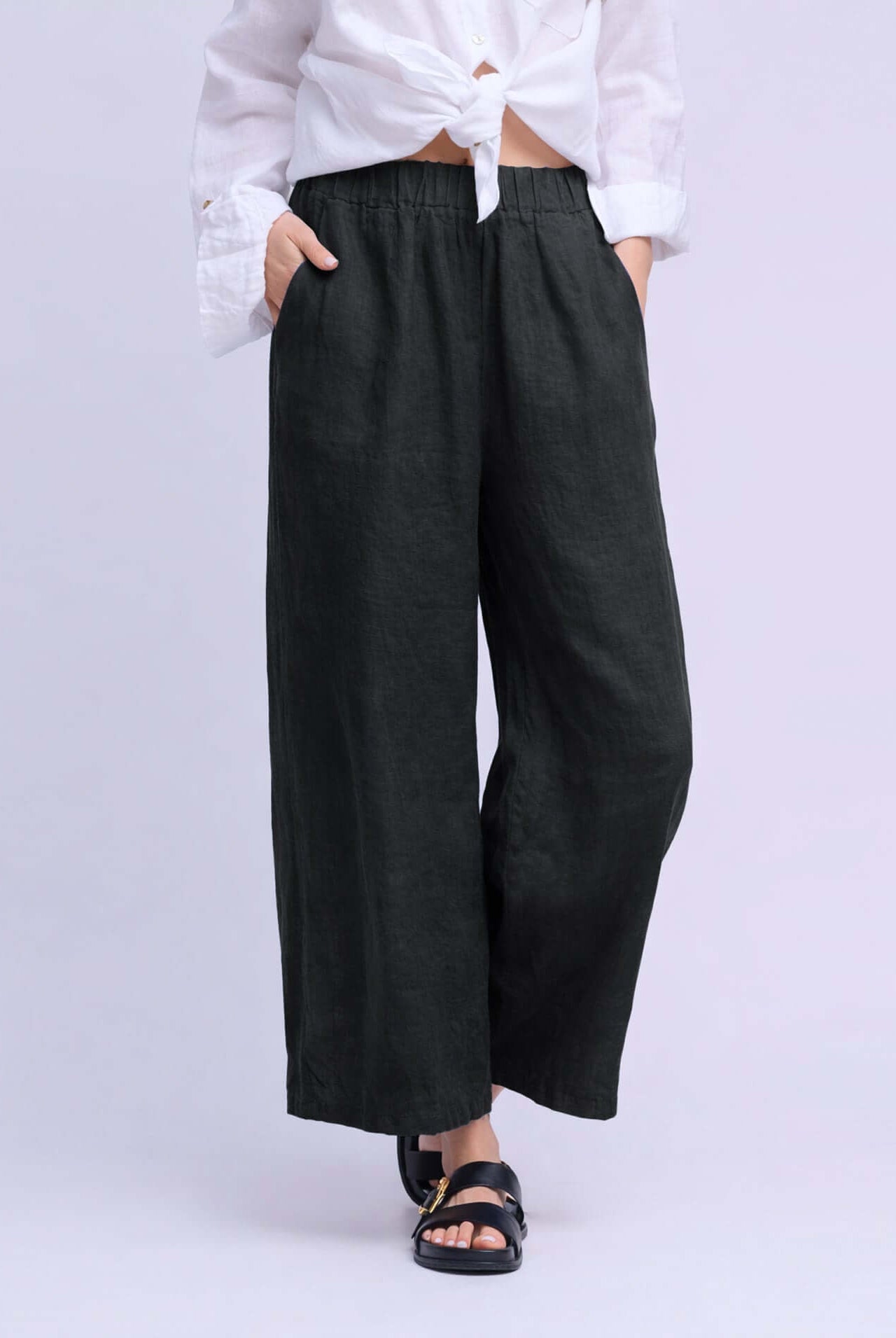 YOGA JEANS Sofia Linen Wide Leg Pant showcased on model wearing a white shirt and sandals.
