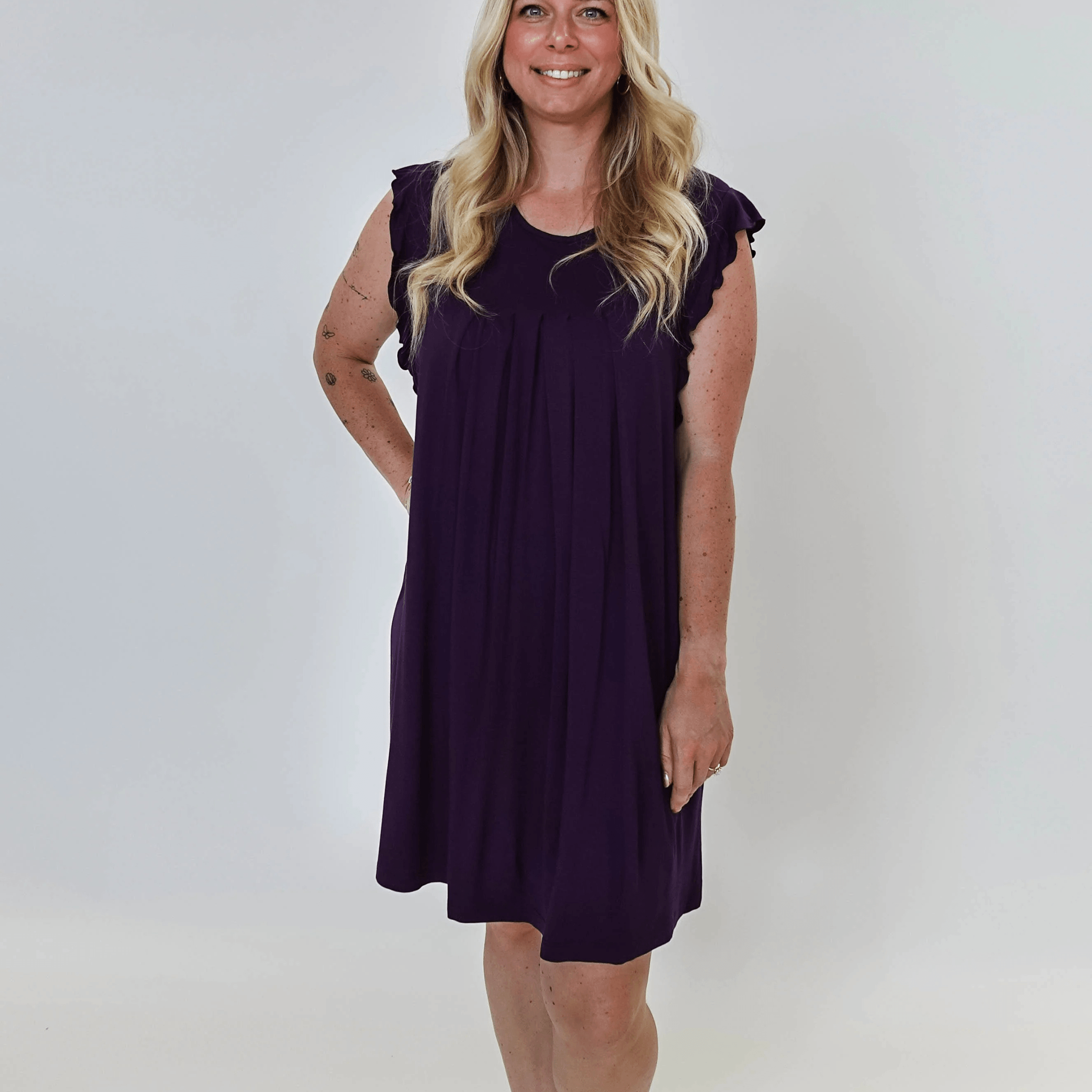 Model wearing Blackberry Amethyst Flutter Bamboo Nightgown in purple, showcasing its elegant design and comfortable fit.