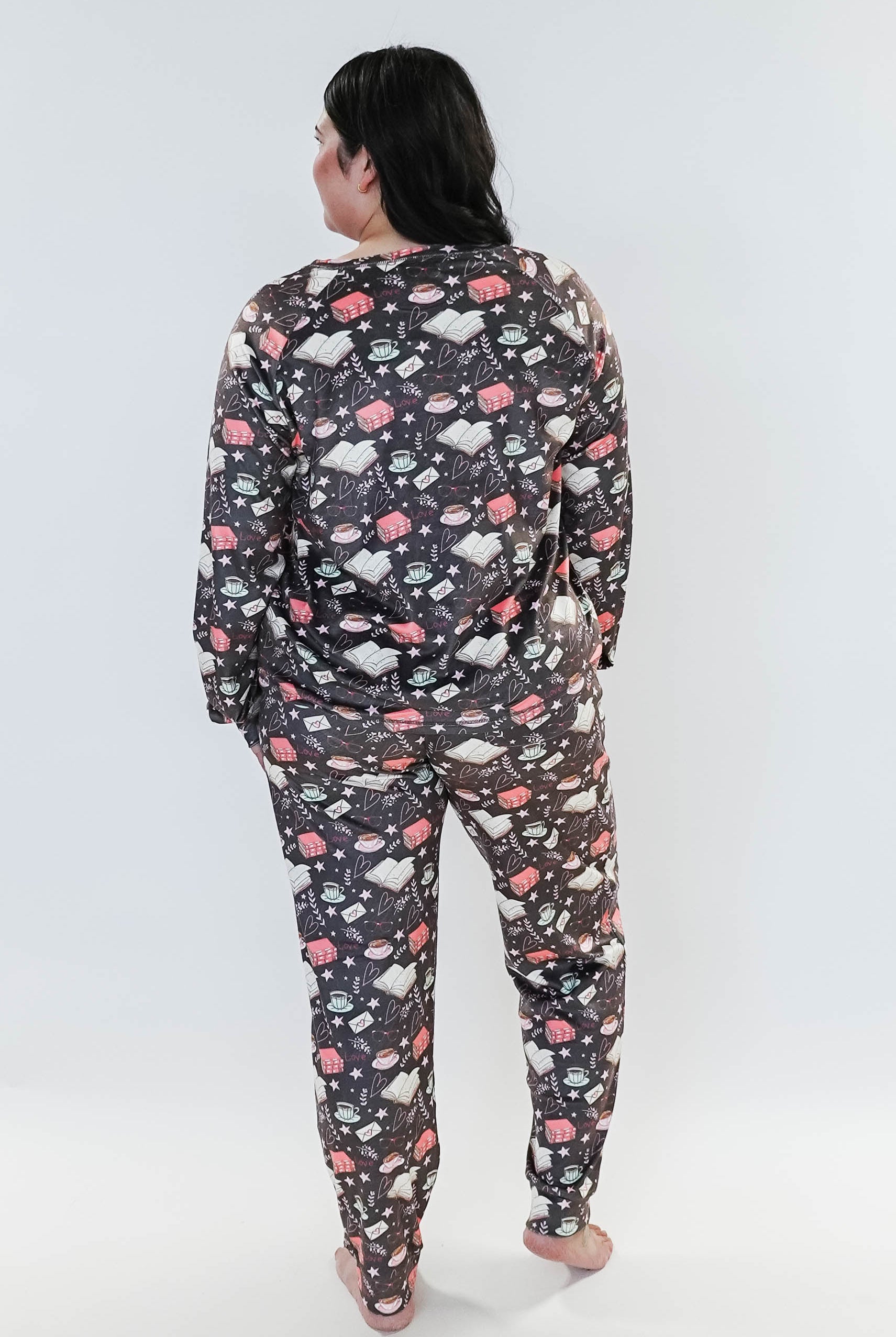 plus size woman wearing book club print velour lounge set with jogger