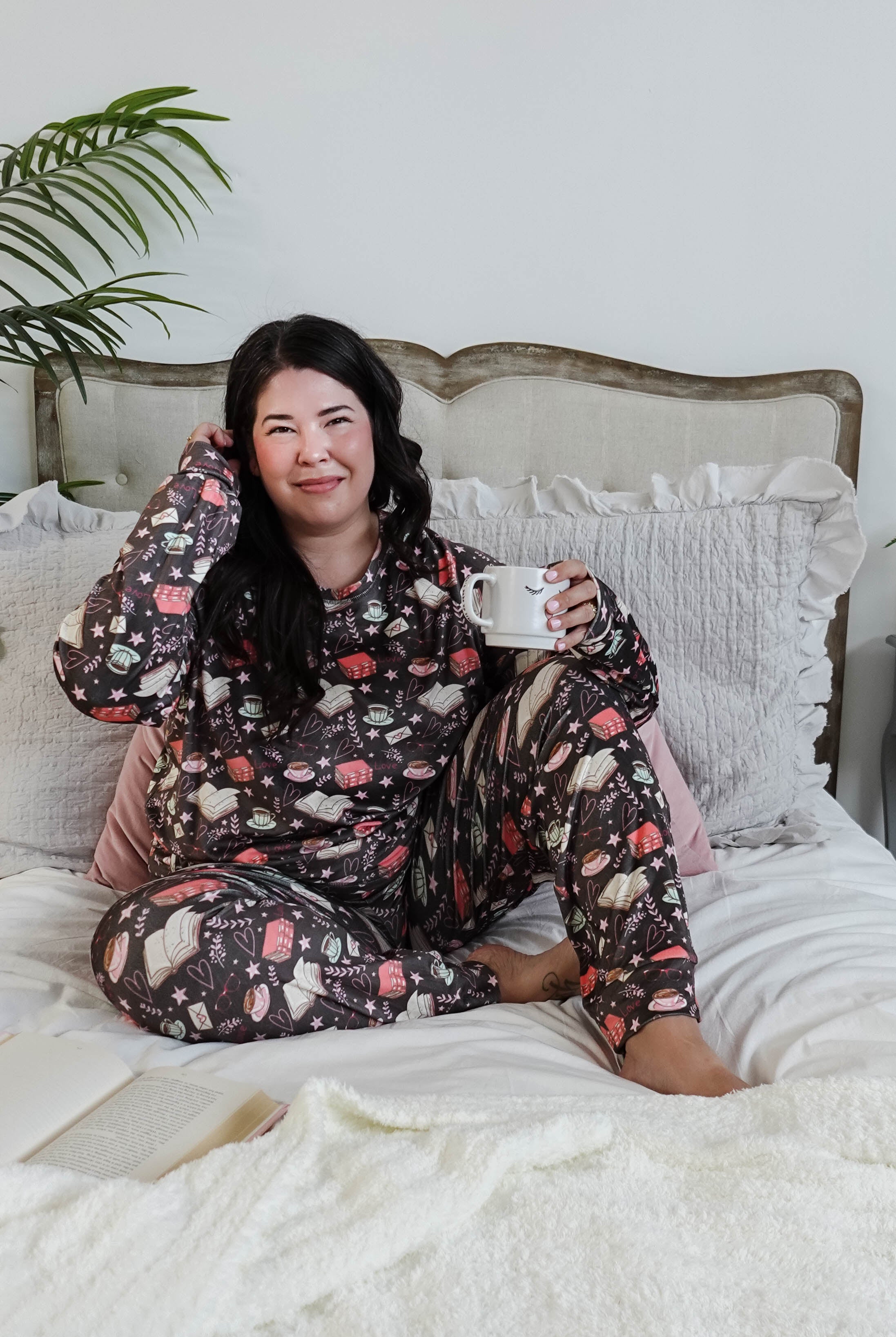 plus size woman wearing book club print velour lounge set with jogger