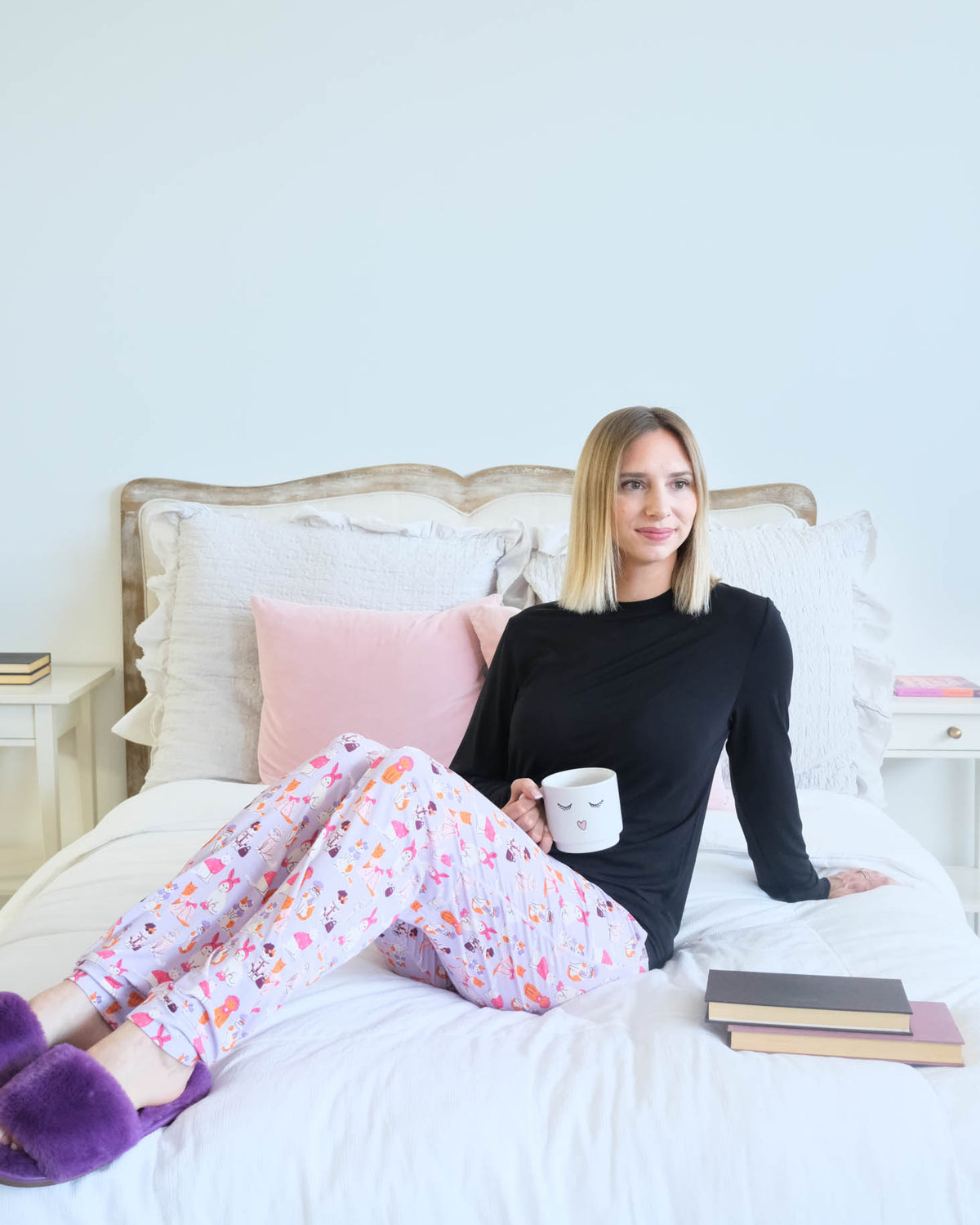 Georgia Rylan Black Long Sleeve Catwalk Print Jogger Bamboo PJ Set lifestyle photo on bed — Cloud Nine Pajamas Edmonton