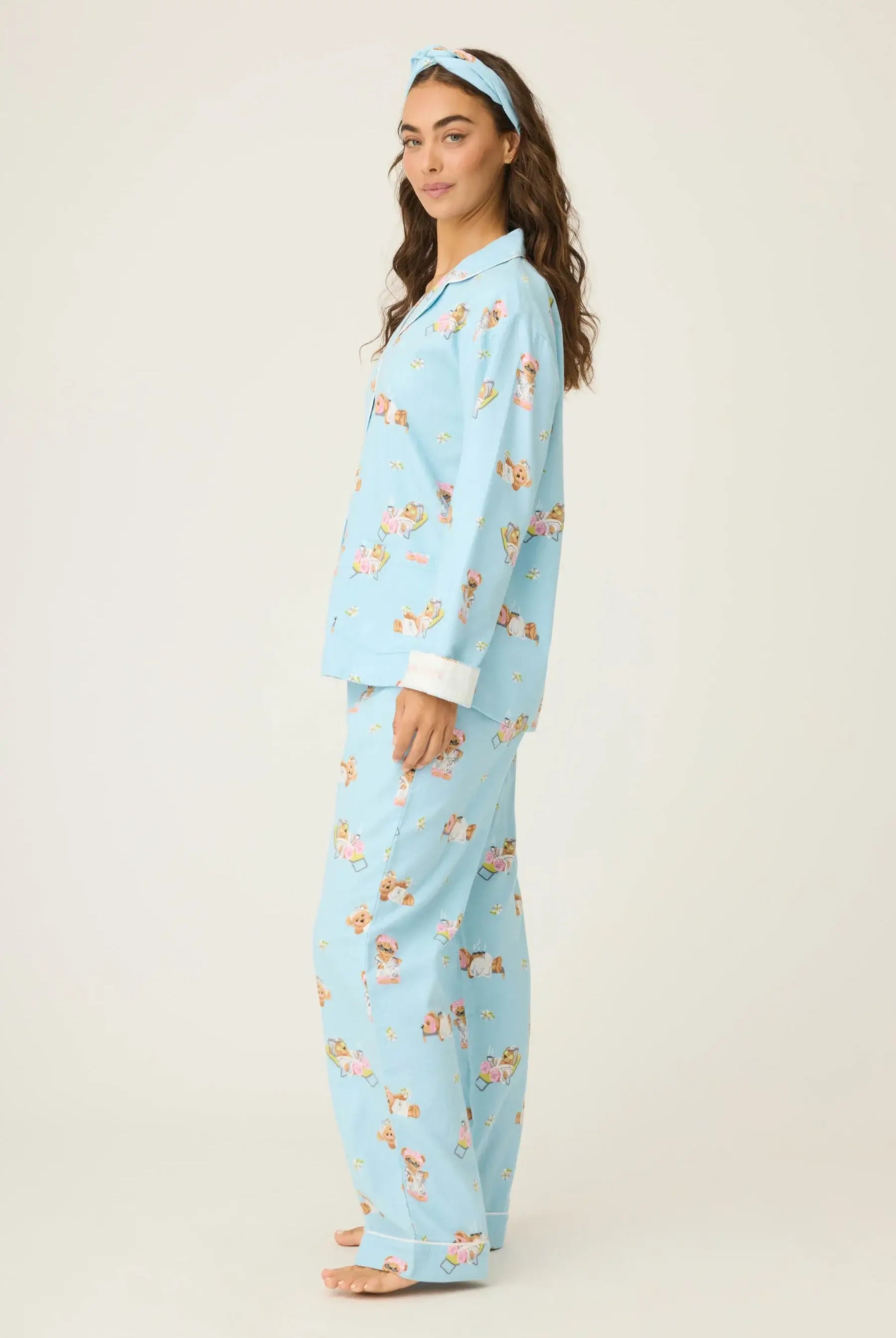 Model wearing Beary Cute Bear Print Flannel PJ Set from PJ Salvage in blue with cute bear prints.
