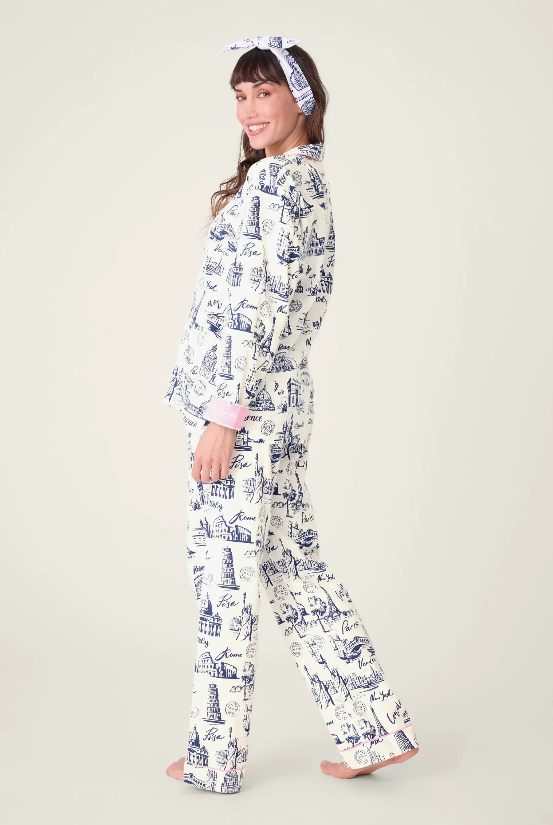 Model wearing BON VOYAGE 3-Piece Flannel PJ Set from PJ SALVAGE with a cheerful smile.