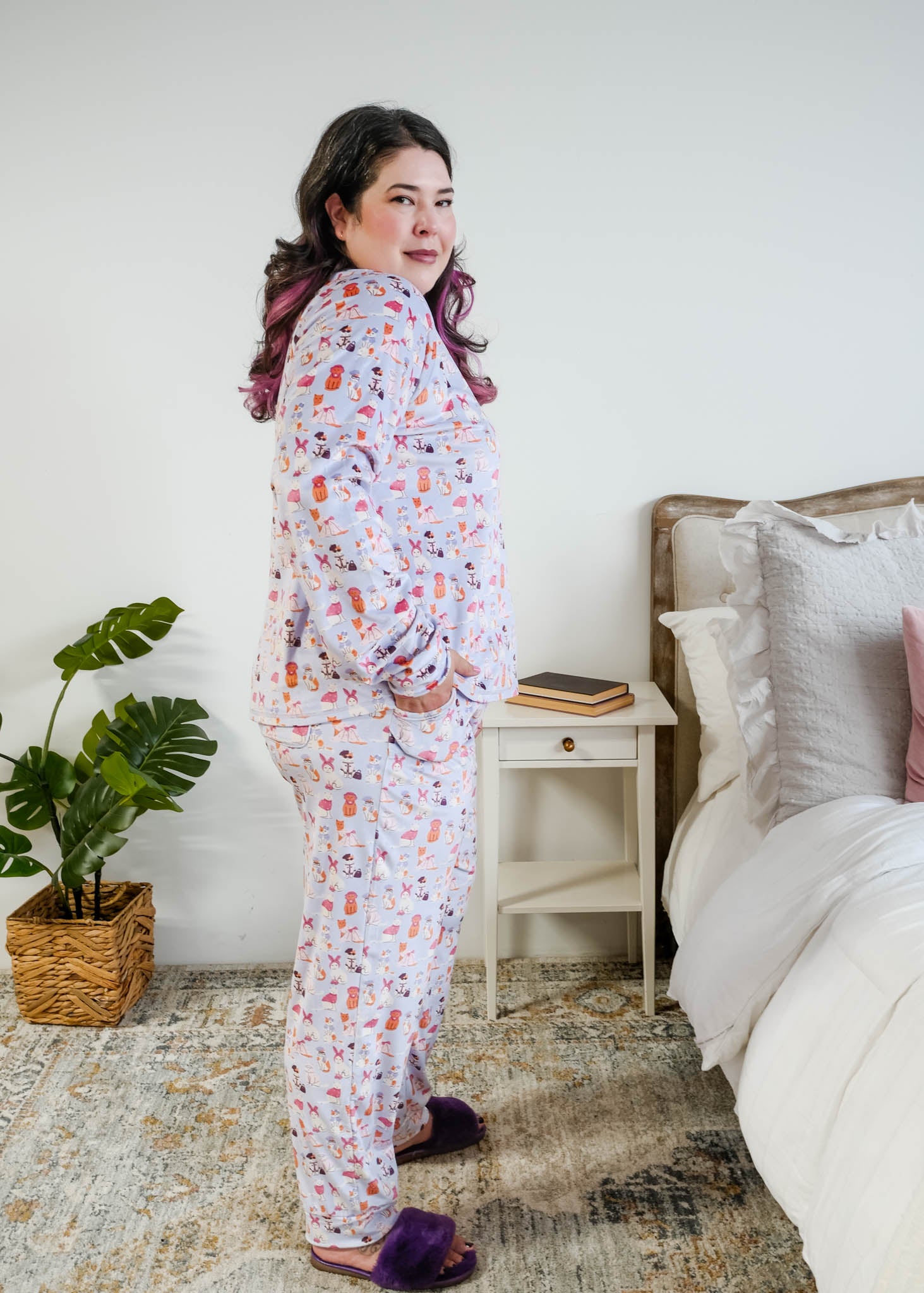 Side profile view on Plus size model Miranda Nic women's purple velour long sleeve top and jogger pants set featuring Catwalk Kitties cat print - Cloud Nine Pajamas