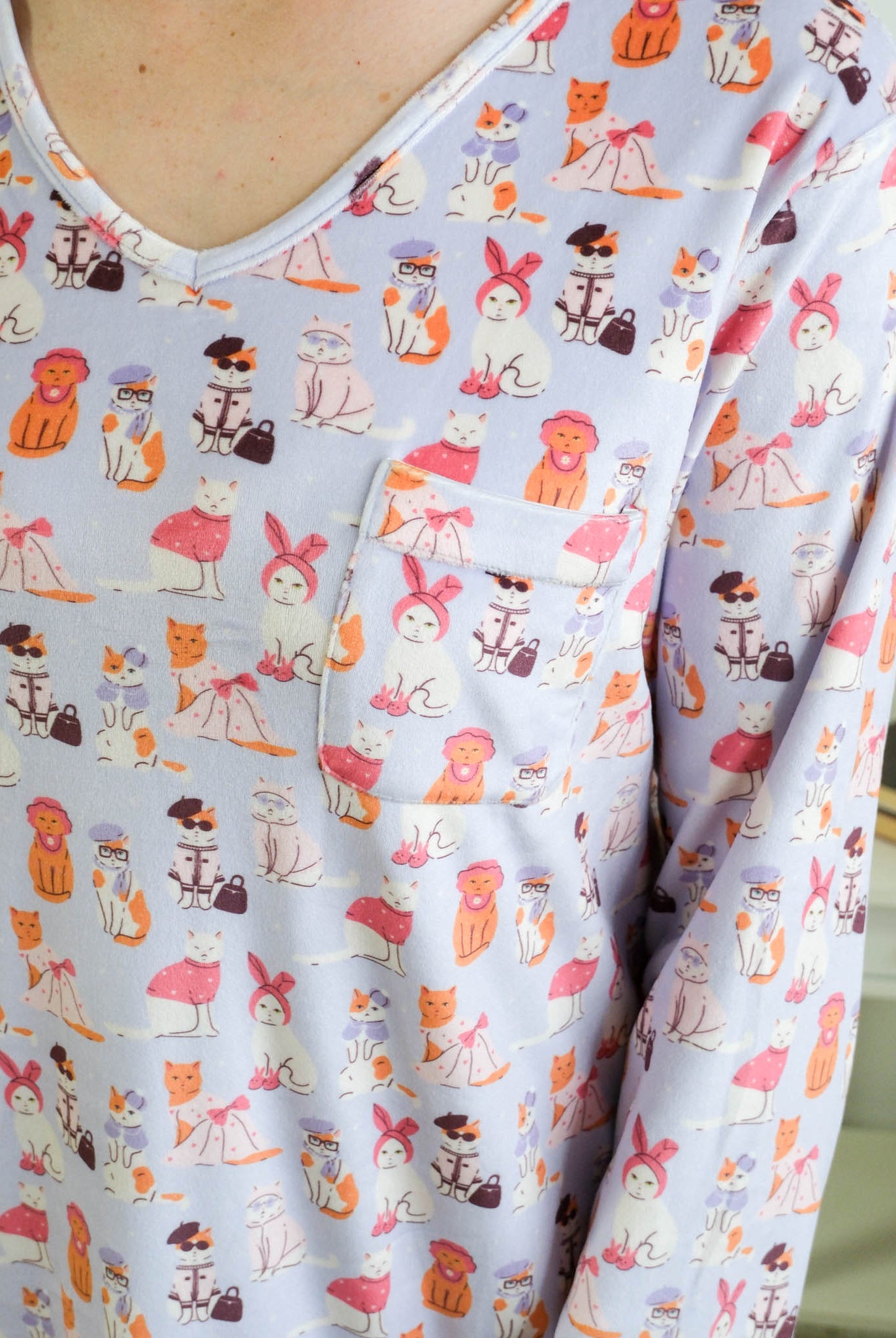 Close up of the Miranda Nic women's purple velour long sleeve nightshirt sleep dress featuring Catwalk Kitties print - Cloud Nine Pajamas.