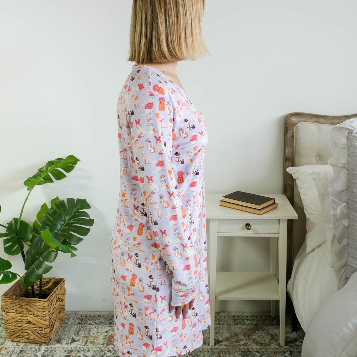 Side View full length on model of Miranda Nic women's purple velour long sleeve nightshirt sleep dress featuring Catwalk Kitties print - Cloud Nine Pajamas.