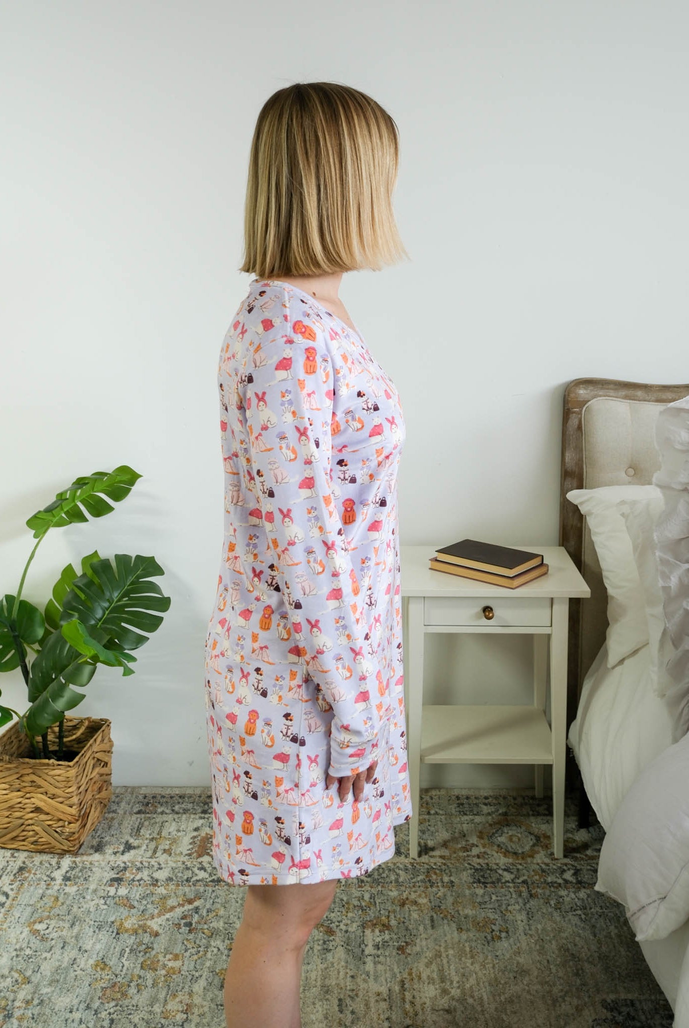 Side View full length on model of Miranda Nic women's purple velour long sleeve nightshirt sleep dress featuring Catwalk Kitties print - Cloud Nine Pajamas.