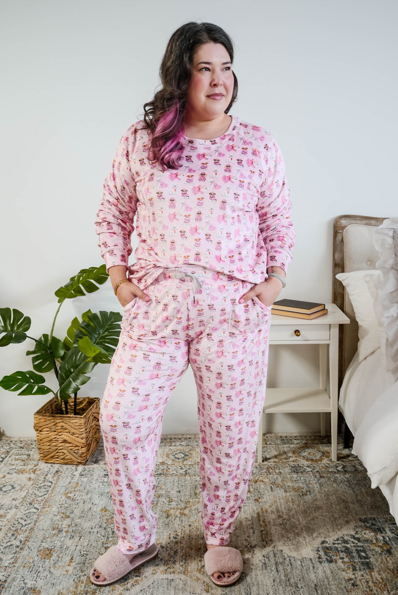 tucked in view on plus size model of the Miranda Nic women's pink velour long sleeve top and jogger pants loungewear set featuring Chic Puppies dog print