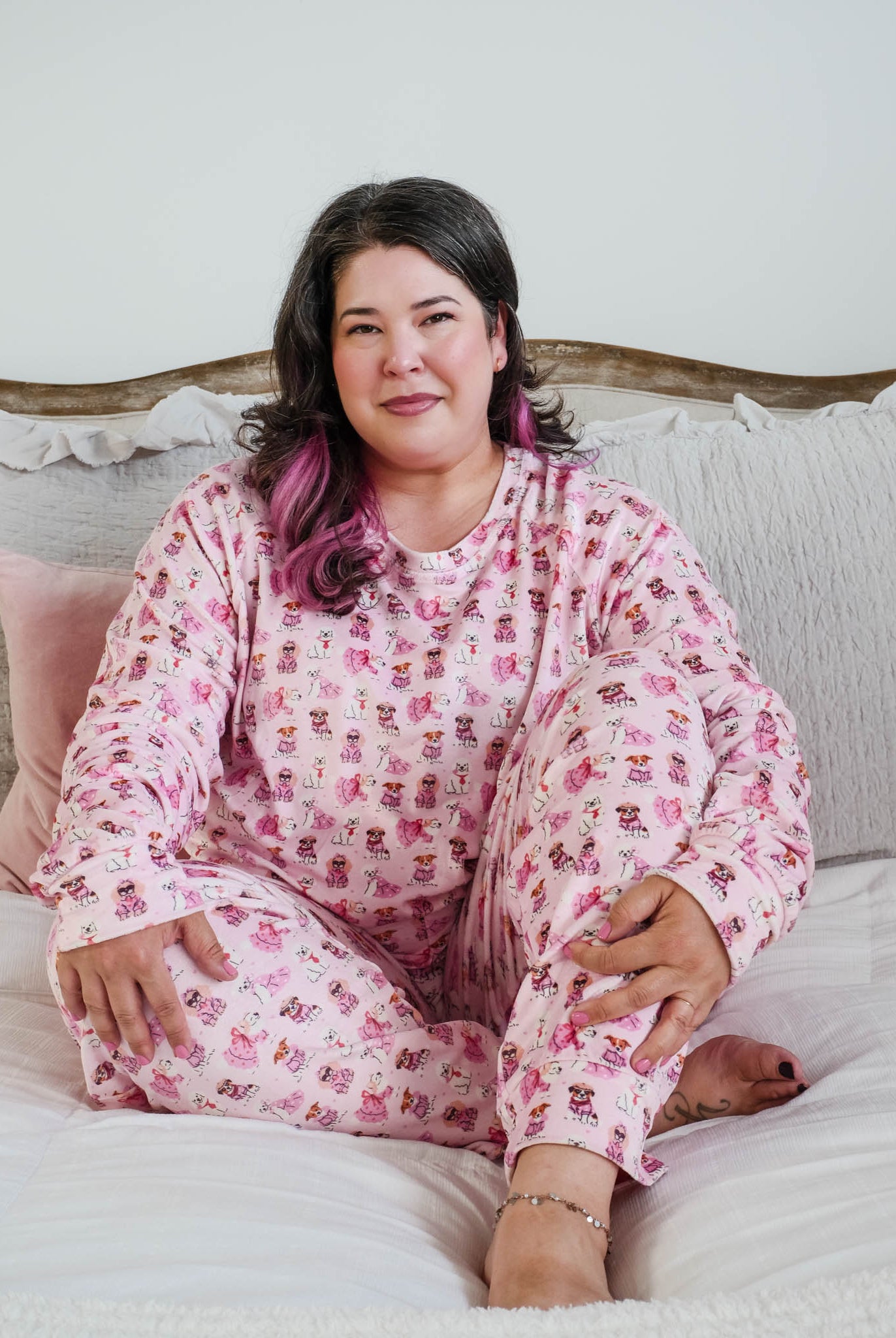 Plus size lifestyle shot on model Miranda Nic women's pink velour long sleeve top and jogger pants loungewear set featuring Chic Puppies dog print