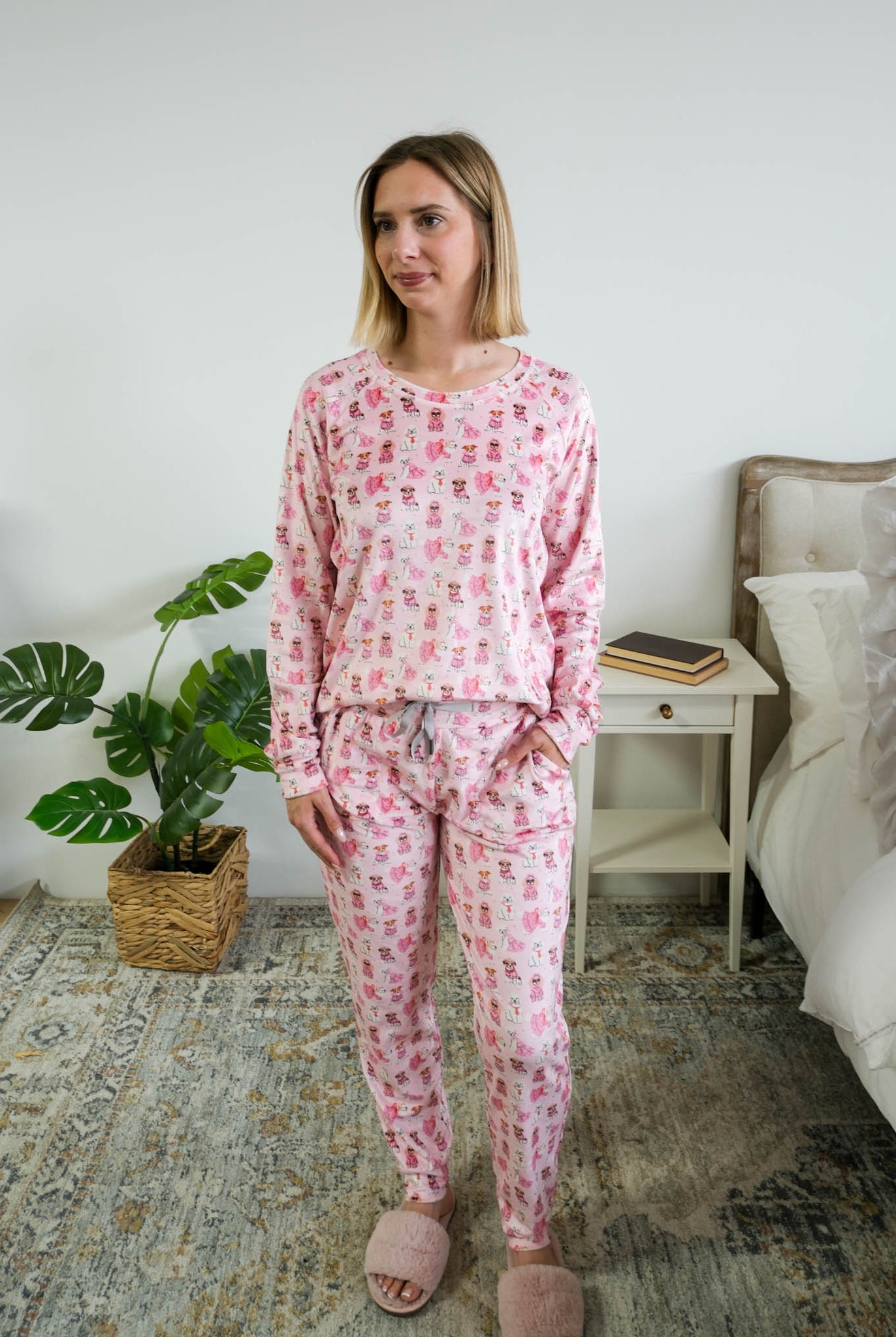 Full length on model of Miranda Nic women's pink velour long sleeve top and jogger pants loungewear set featuring Chic Puppies dog print with pockets - Cloud Nine Pajamas