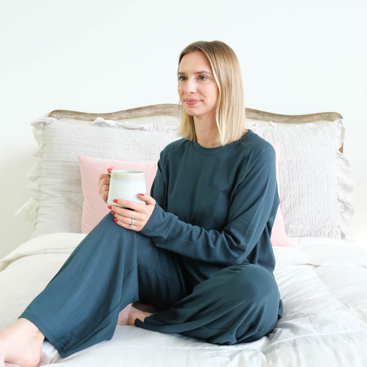 Miranda Nic Cloud Soft Teal Bamboo Lounge Set model seated lifestyle — Cloud Nine Pajamas Edmonton