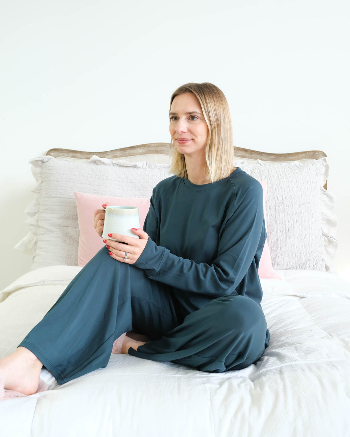 Miranda Nic Cloud Soft Teal Bamboo Lounge Set model seated lifestyle — Cloud Nine Pajamas Edmonton