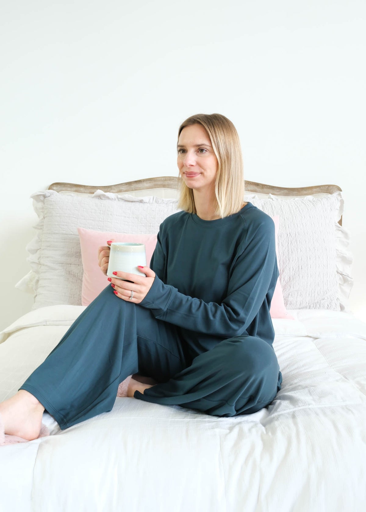 Miranda Nic Cloud Soft Teal Bamboo Lounge Set model seated lifestyle — Cloud Nine Pajamas Edmonton