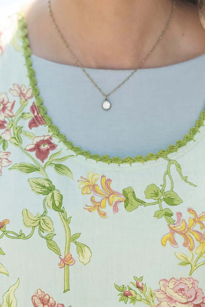 April Cornell Milene Cotton Pinafore Midi Dress Sage Green with Hand-Crochet Neckline showing close up of the neckline