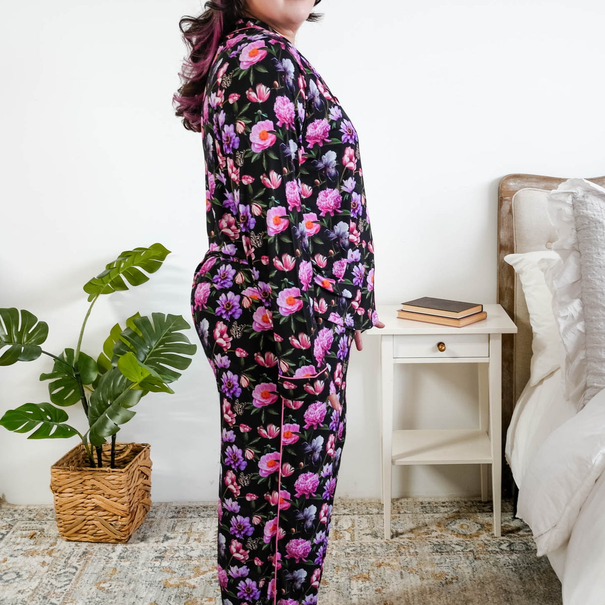 Georgia Rylan women's bamboo long sleeve button-up top and straight-leg pajama pants in Dreamy Blooms black floral print - Cloud Nine Pajamas side profile on plus size model