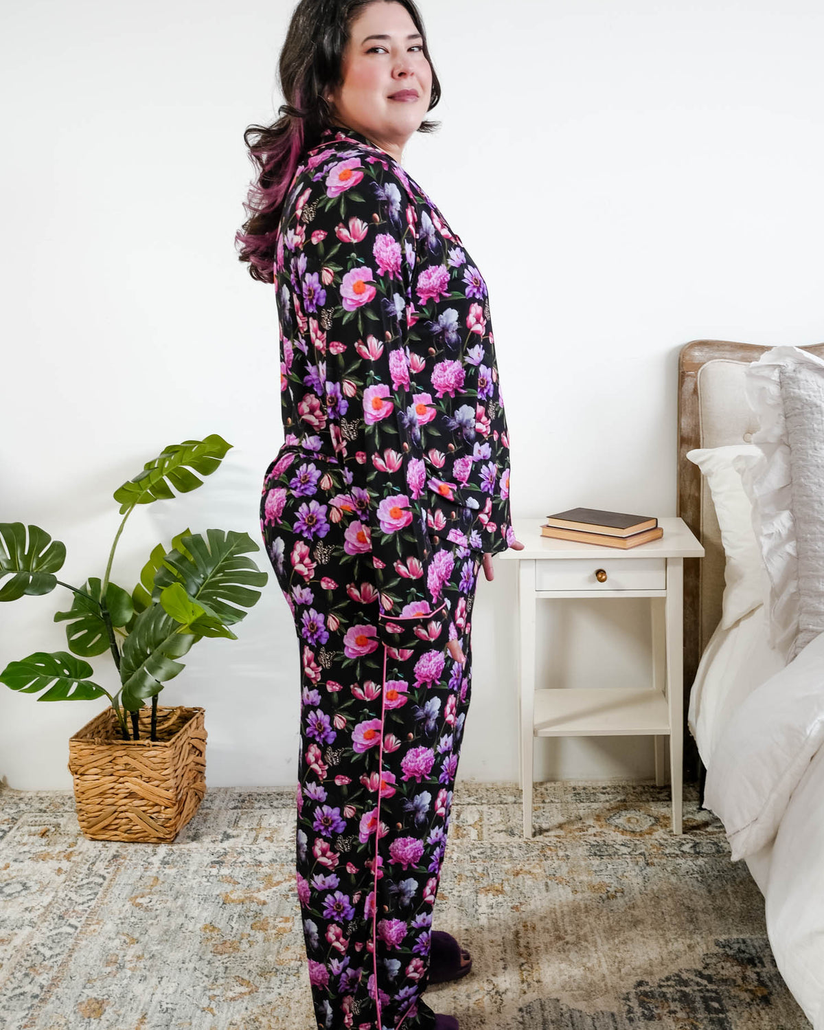 Georgia Rylan women's bamboo long sleeve button-up top and straight-leg pajama pants in Dreamy Blooms black floral print - Cloud Nine Pajamas side profile on plus size model