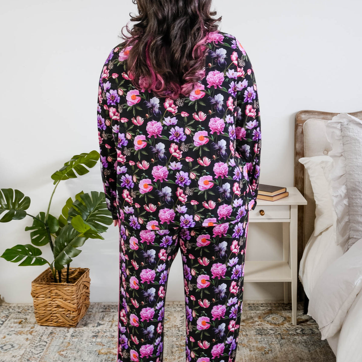 Georgia Rylan women's bamboo long sleeve button-up top and straight-leg pajama pants in Dreamy Blooms black floral print - Cloud Nine Pajamas back view on plus size model