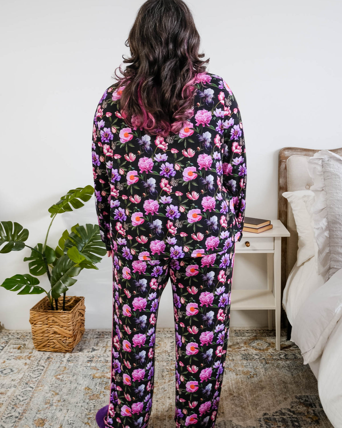 Georgia Rylan women's bamboo long sleeve button-up top and straight-leg pajama pants in Dreamy Blooms black floral print - Cloud Nine Pajamas back view on plus size model