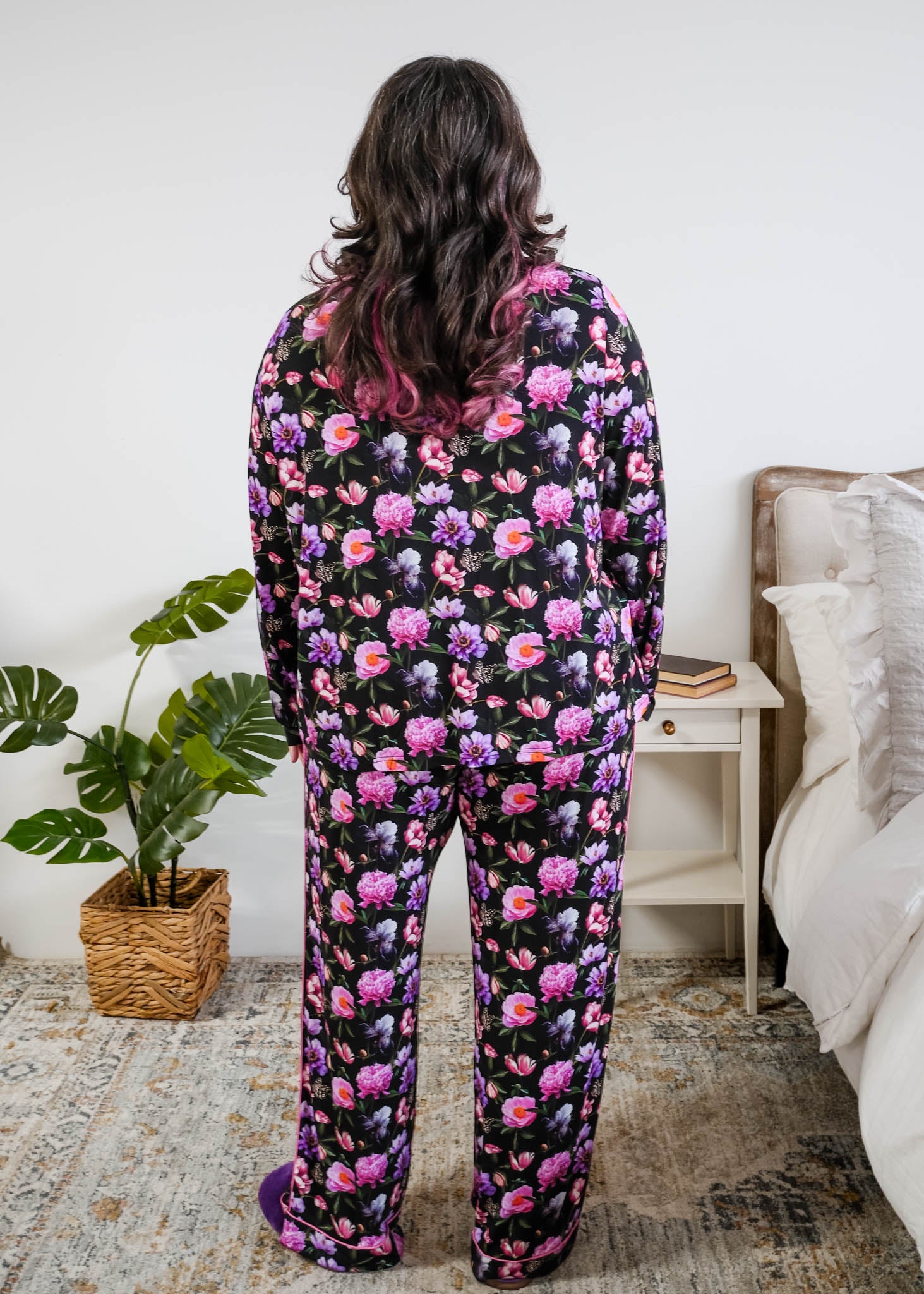 Georgia Rylan women's bamboo long sleeve button-up top and straight-leg pajama pants in Dreamy Blooms black floral print - Cloud Nine Pajamas back view on plus size model