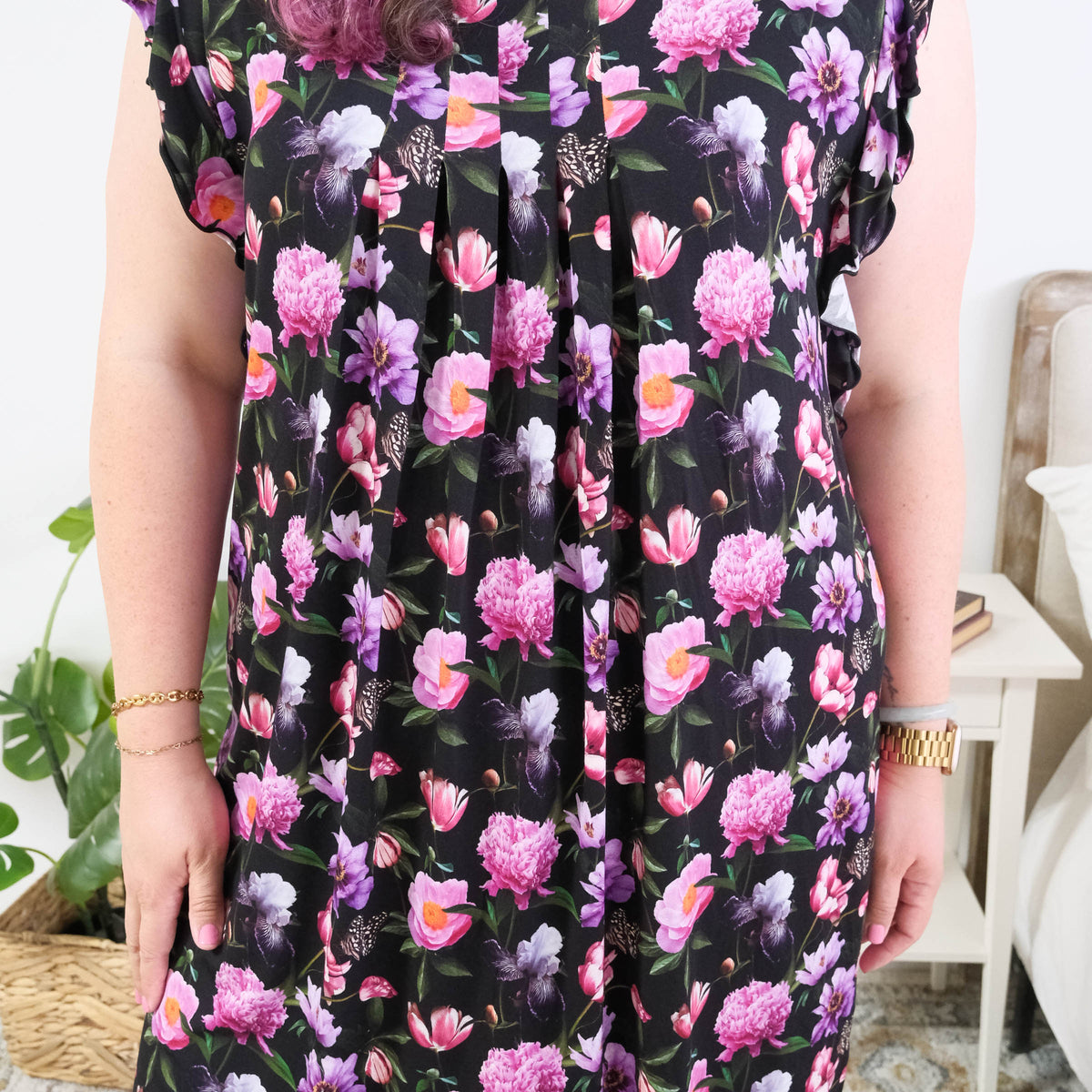 Georgia Rylan women's bamboo flutter sleeve nightgown dress in Dreamy Blooms black floral print - Cloud Nine Pajamas pleated front of the nightgown on plus size model