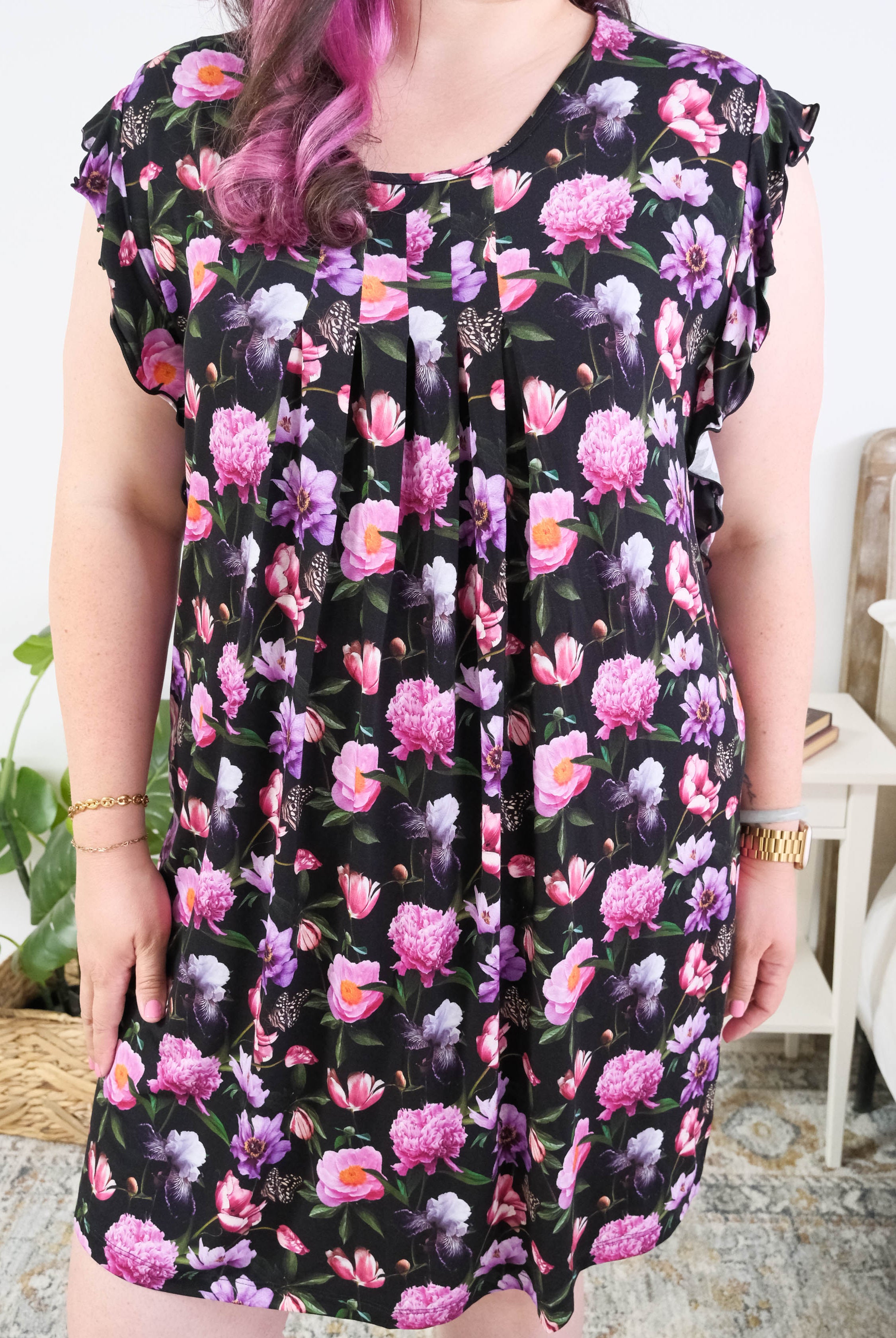 Georgia Rylan women's bamboo flutter sleeve nightgown dress in Dreamy Blooms black floral print - Cloud Nine Pajamas pleated front of the nightgown on plus size model