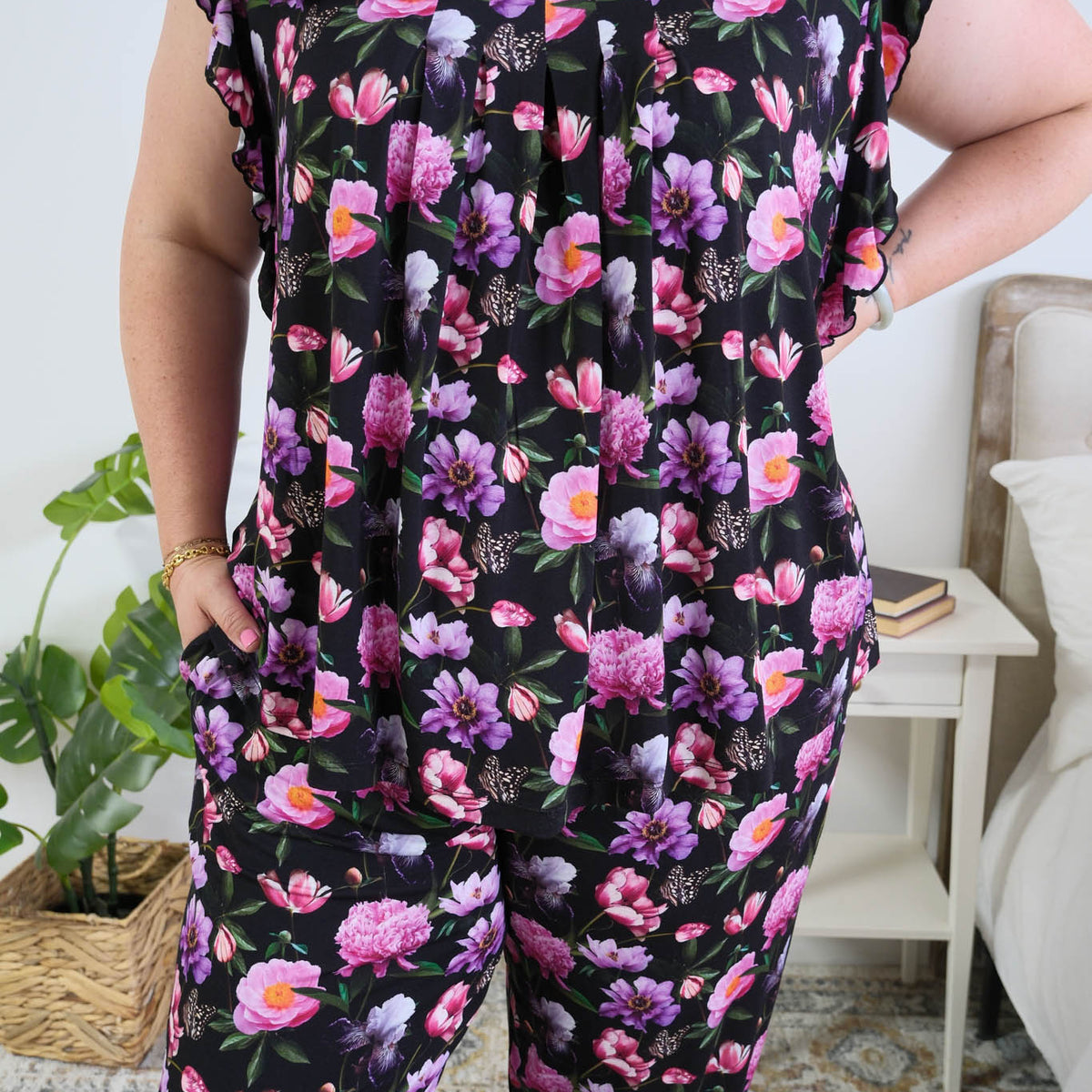 Georgia Rylan women's bamboo flutter sleeve top and soft jogger pajama pants set in Dreamy Blooms black floral print - Cloud Nine Pajamas pleated front detail on plus size model