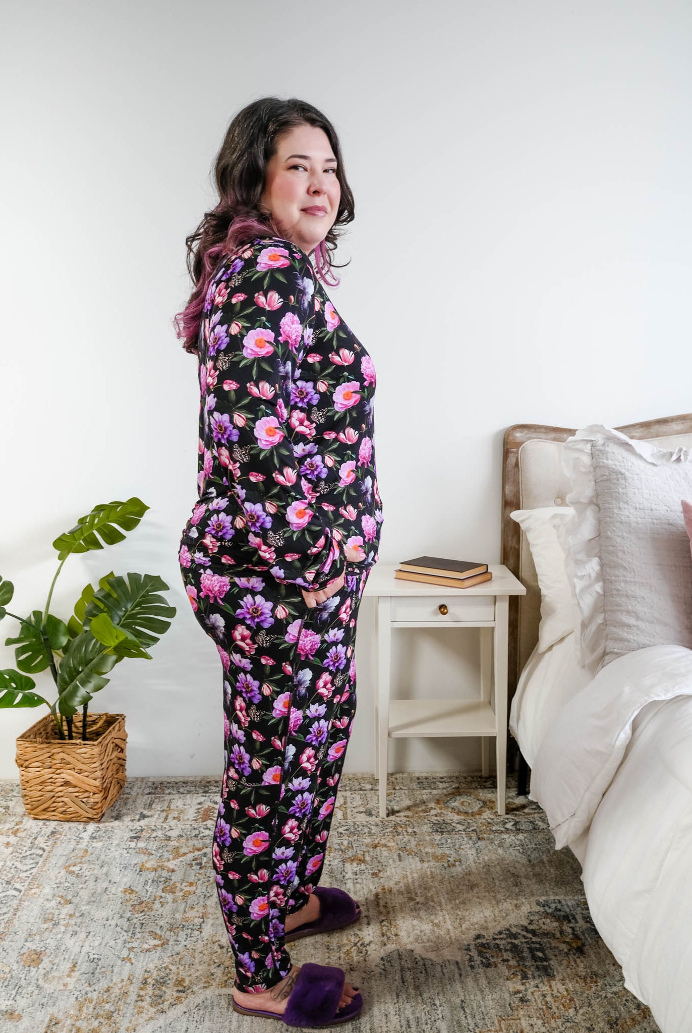 Georgia Rylan women's long sleeve crewneck top and jogger pajama pants set in Dreamy Blooms black floral bamboo Cloud Nine Pajamas side view on plus size model with black hair