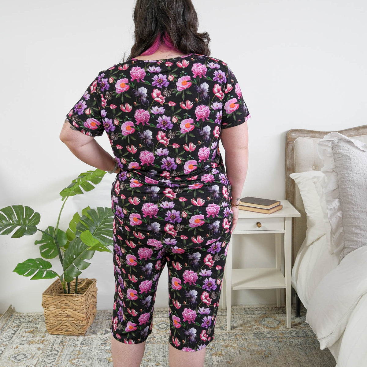 Georgia Rylan women's bamboo rolled-sleeve t-shirt and capri pajama pants in Dreamy Blooms black floral print - Cloud Nine Pajamas back view plus size model