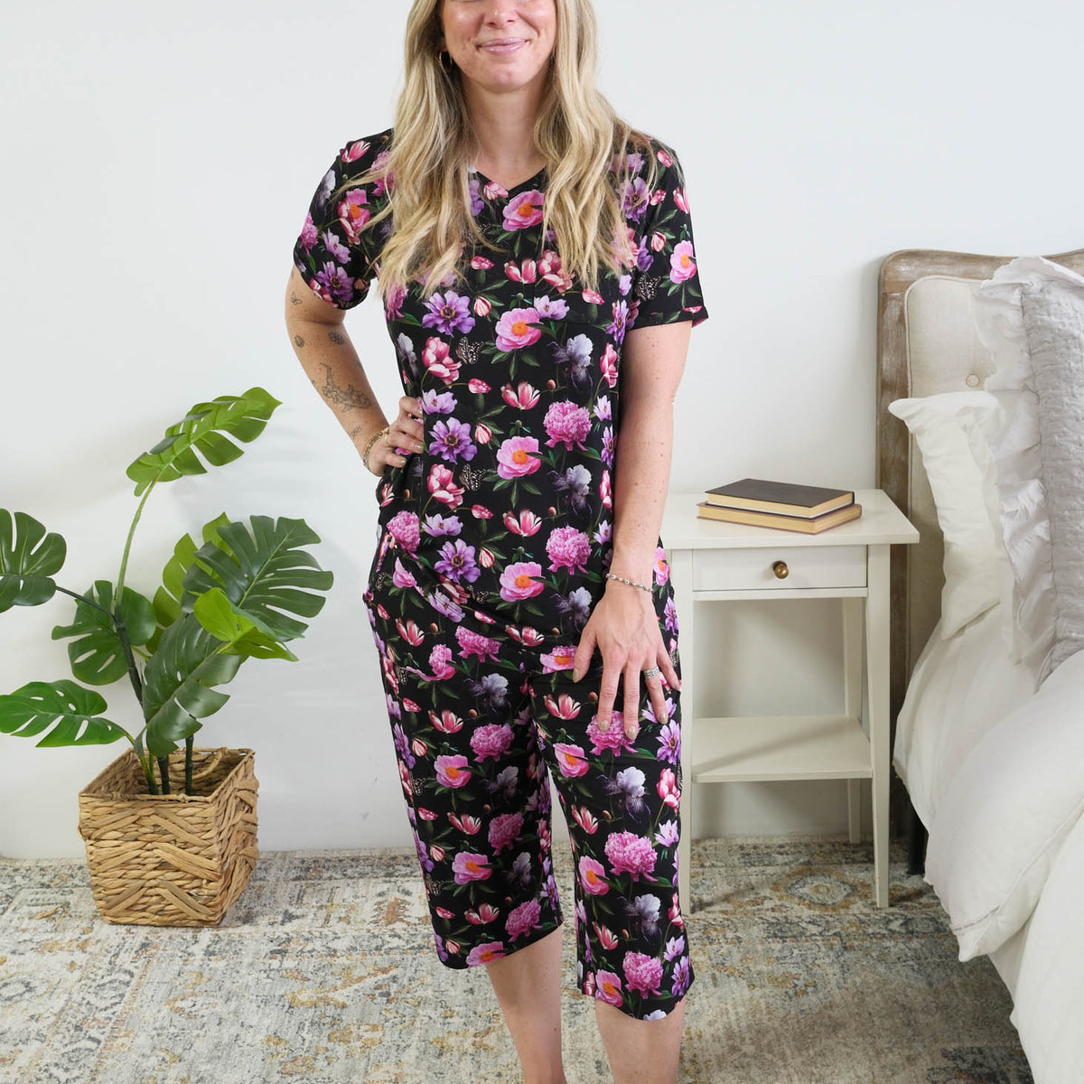 Georgia Rylan women's bamboo rolled-sleeve t-shirt and capri pajama pants in Dreamy Blooms black floral print - Cloud Nine Pajamas full length view on model