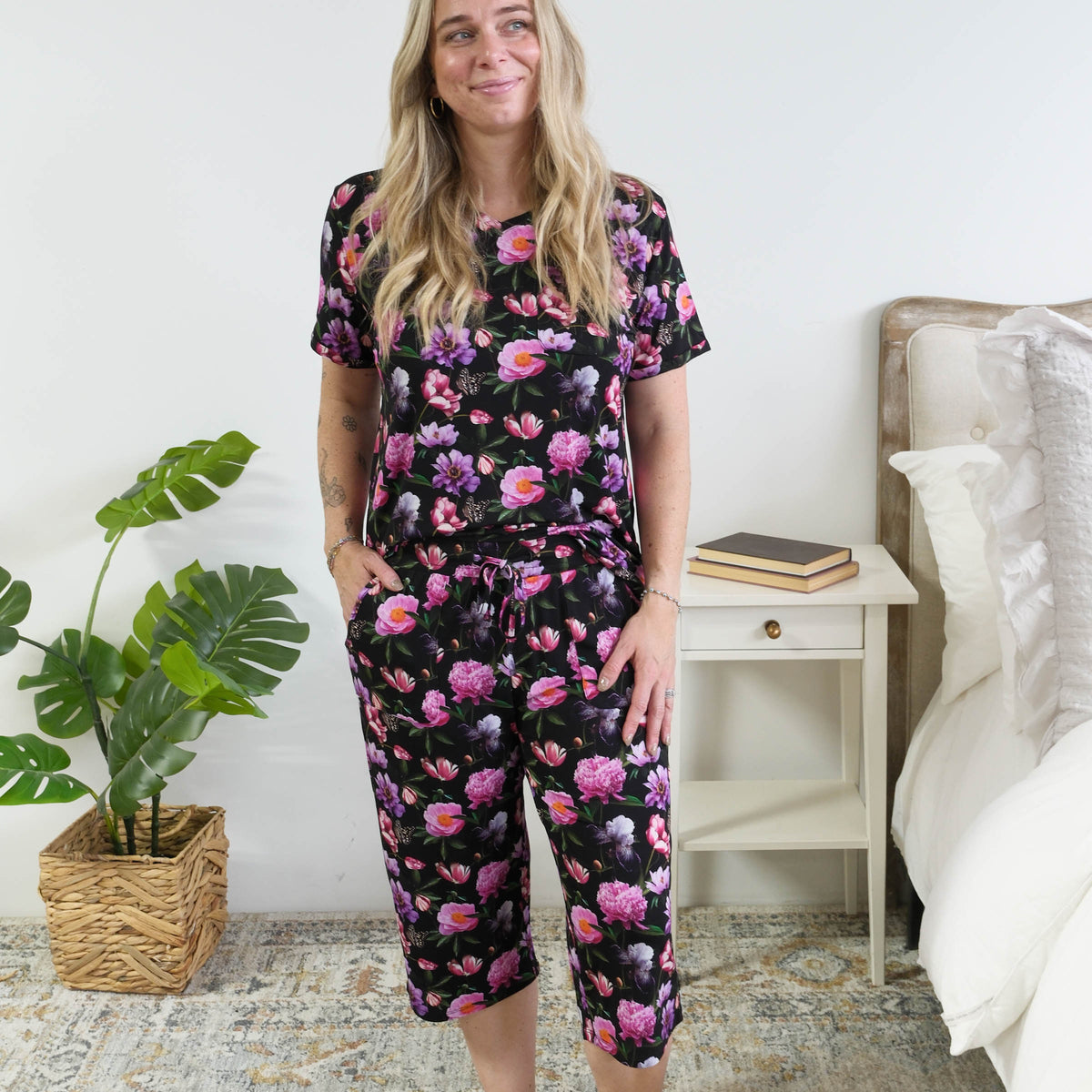 Georgia Rylan women's bamboo rolled-sleeve t-shirt and capri pajama pants in Dreamy Blooms black floral print - Cloud Nine Pajamas full length view on short model