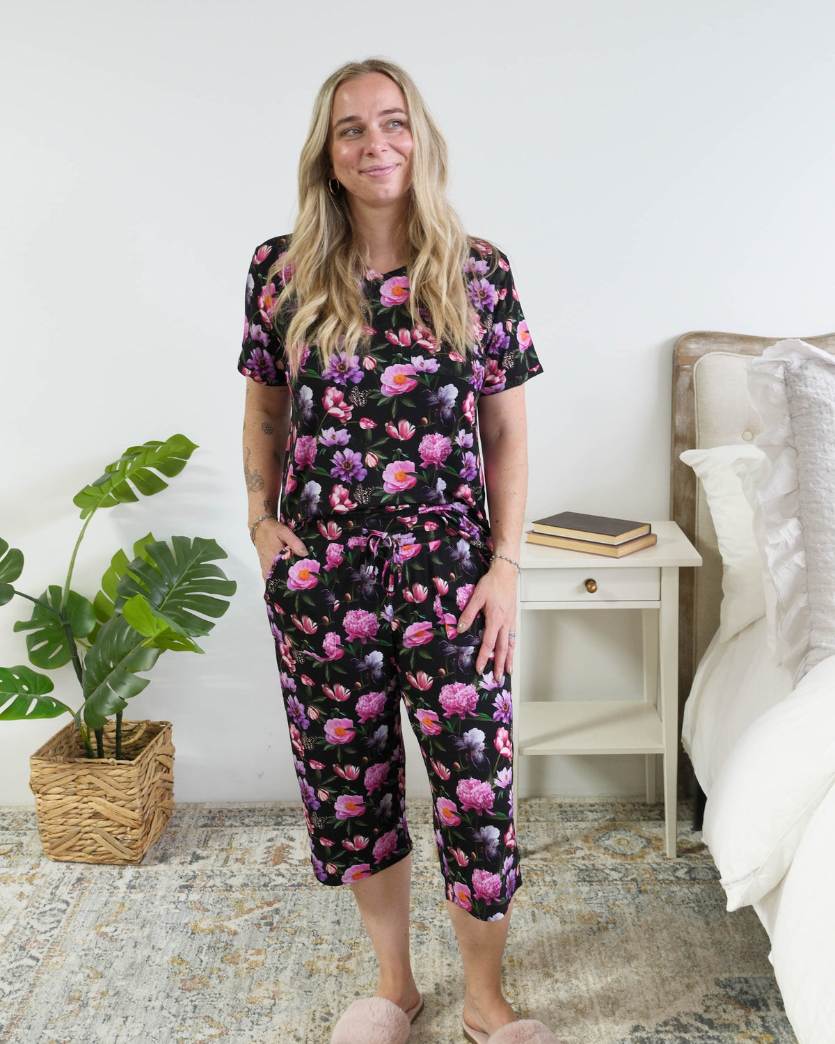 Georgia Rylan women's bamboo rolled-sleeve t-shirt and capri pajama pants in Dreamy Blooms black floral print - Cloud Nine Pajamas full length view on short model