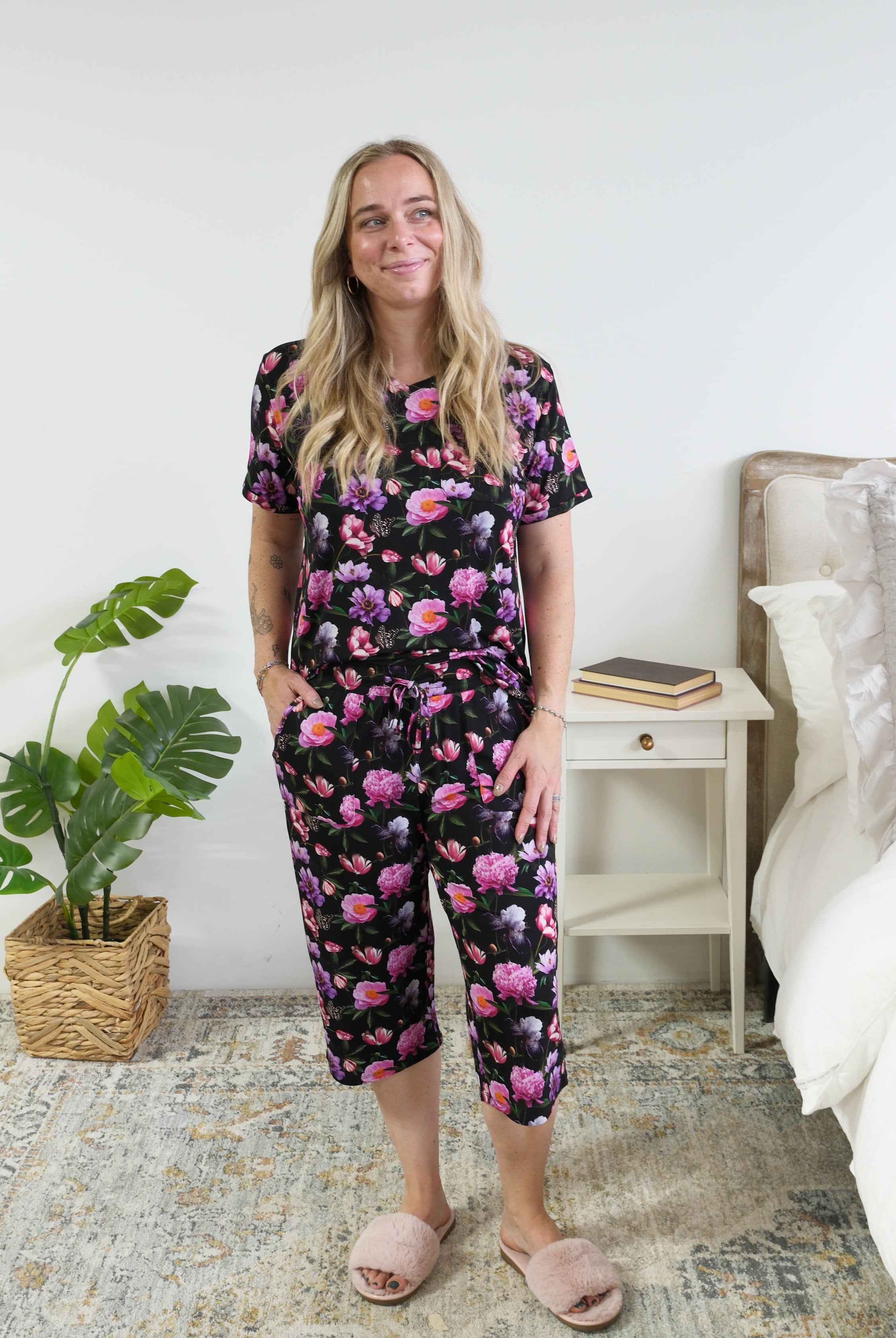 Georgia Rylan women's bamboo rolled-sleeve t-shirt and capri pajama pants in Dreamy Blooms black floral print - Cloud Nine Pajamas full length view on short model