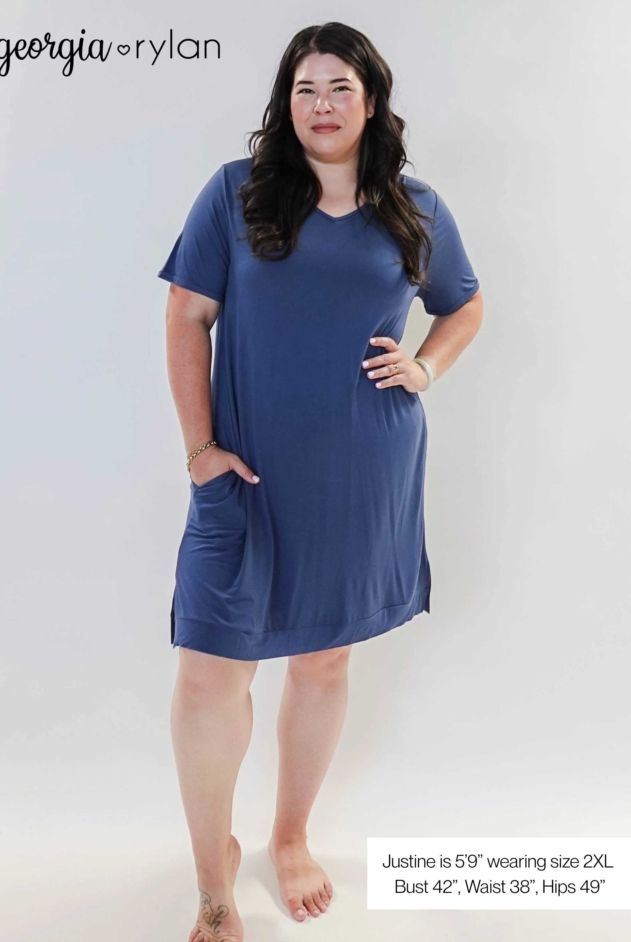 Stylish model wearing Denim Blue V Neck Bamboo Nightshirt dress with pockets, showcasing versatility in sleepwear and everyday fashion.