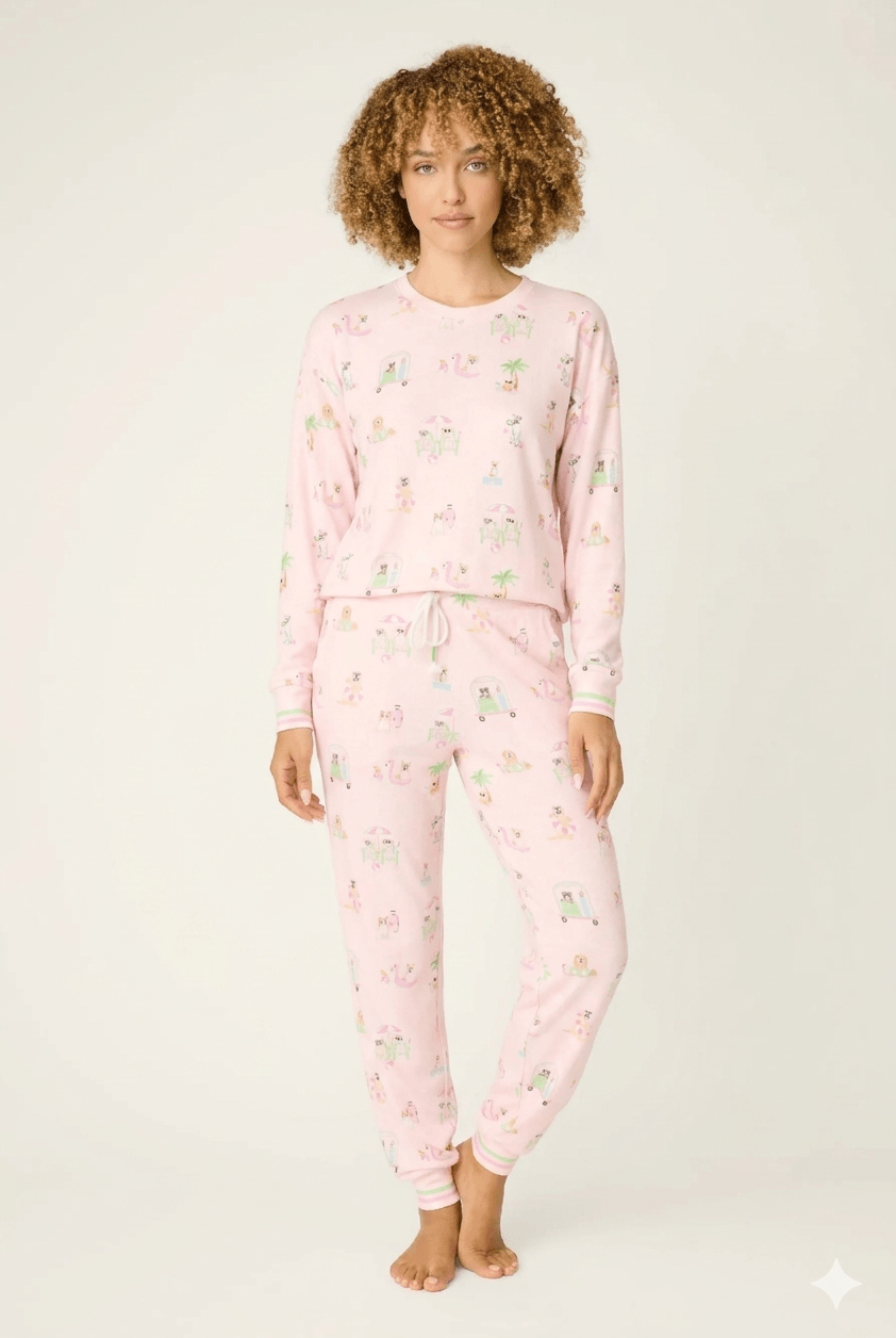 Model wearing Pupcation Palms Sunnies & Sunshine Dog Print Jogger Set by PJ Salvage in pink with playful dog prints.