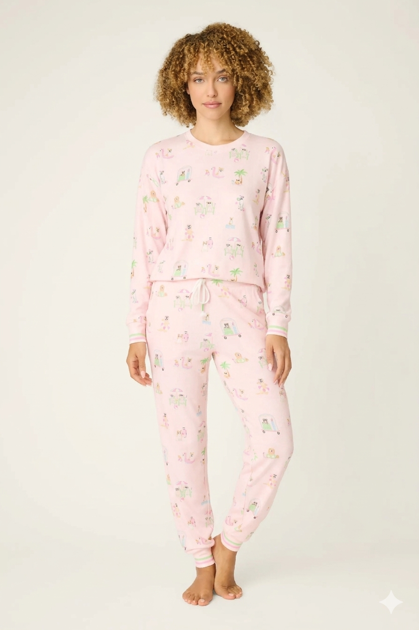 Model wearing Pupcation Palms Sunnies & Sunshine Dog Print Jogger Set by PJ Salvage in pink with playful dog prints.