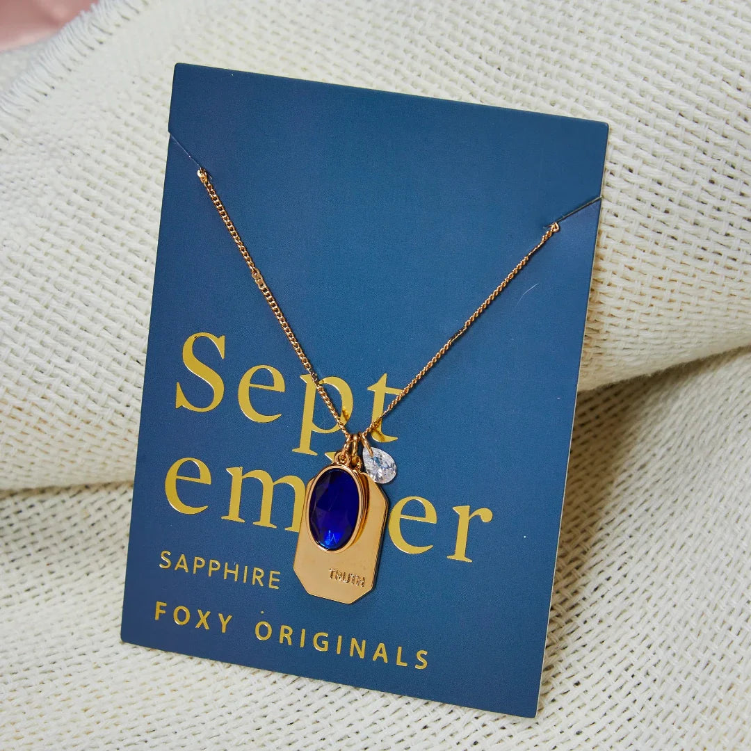 Birthstone Charm Necklace in 14k Plated Gold featuring September sapphire stone and 'TRUTH' charm by Foxy Originals.