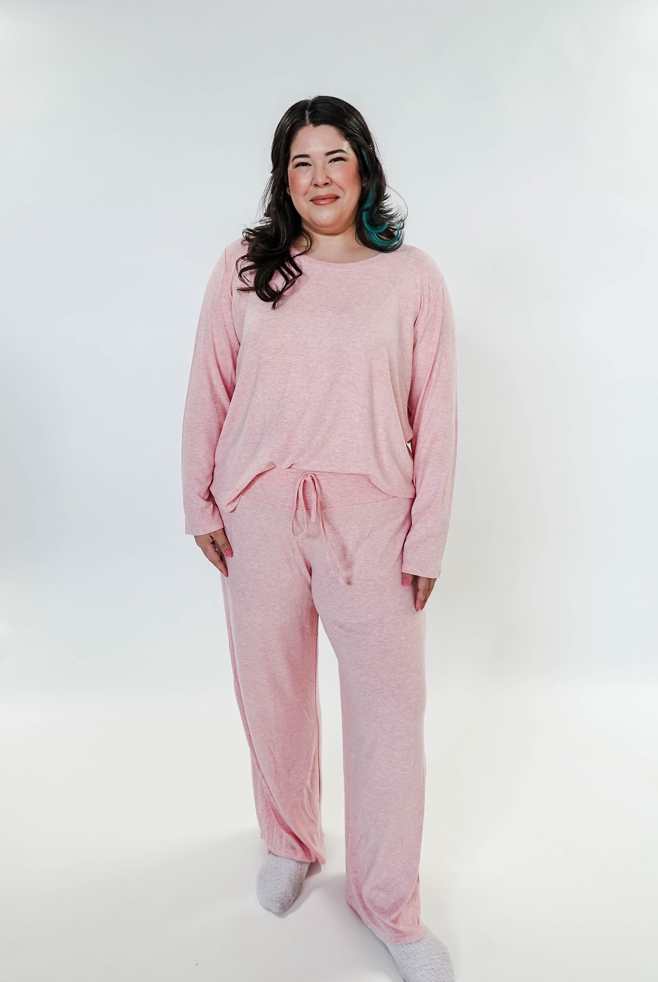 plus size woman standing wearing heather pink lounge set by miranda nic