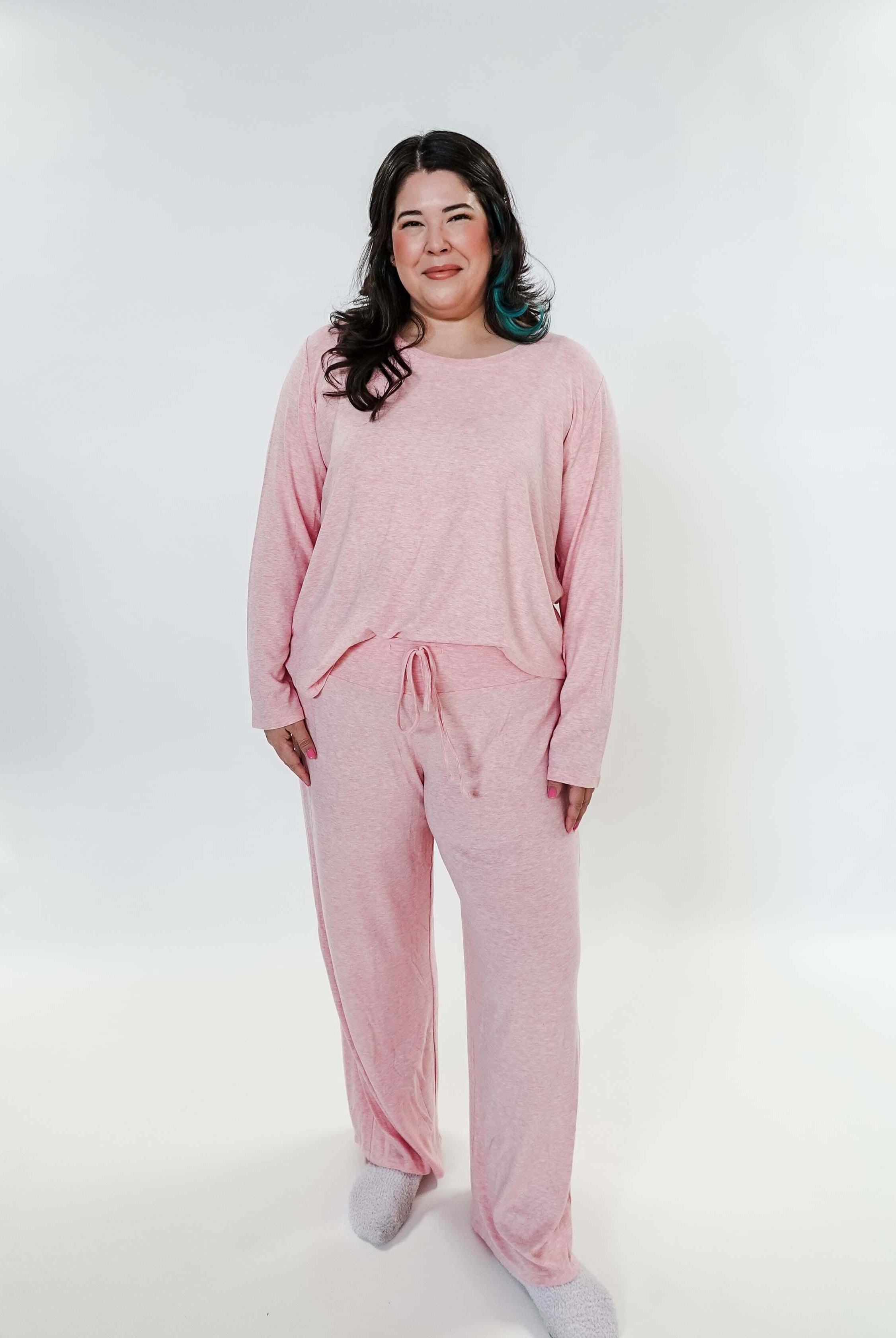 plus size woman standing wearing heather pink lounge set by miranda nic